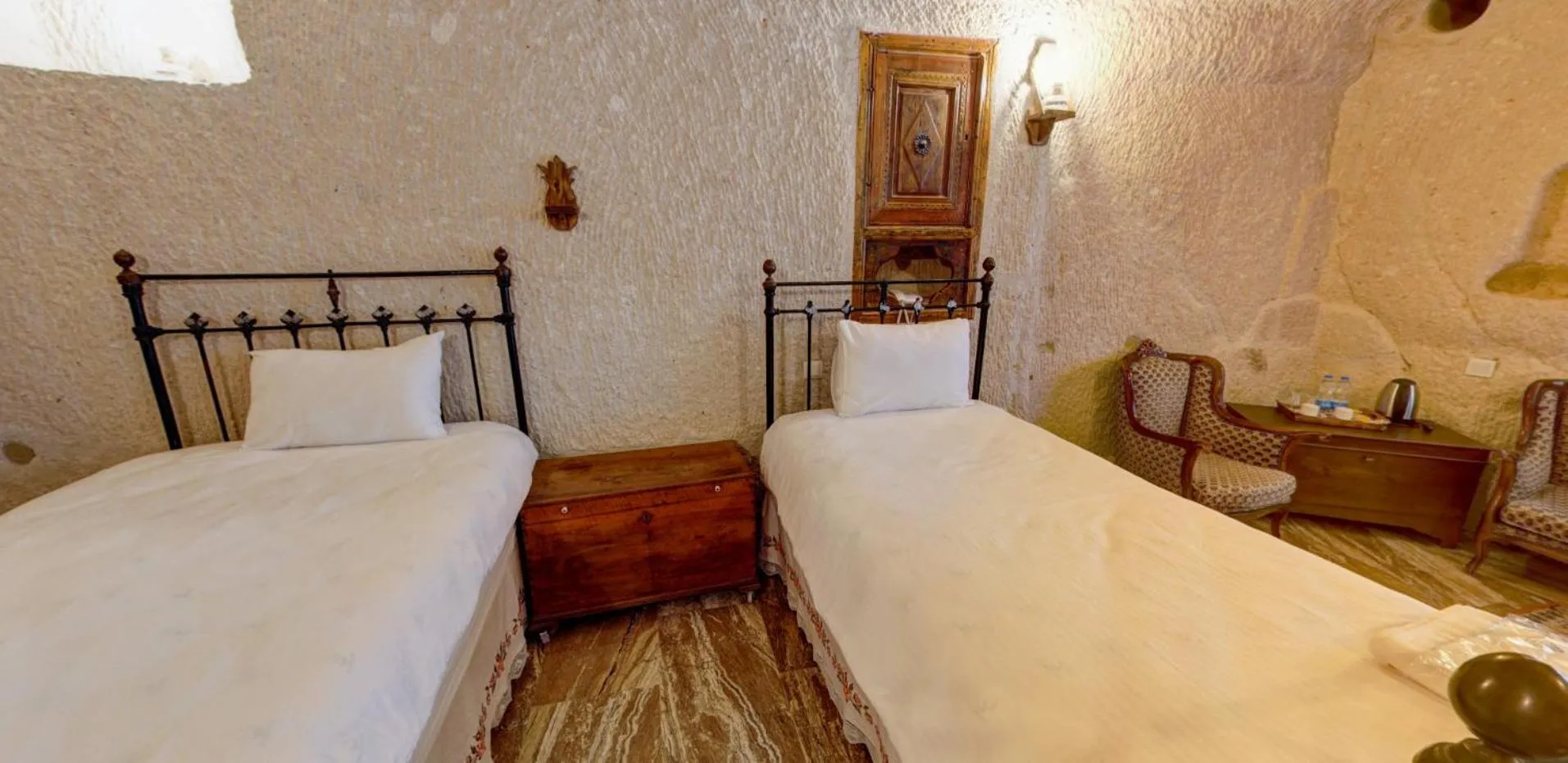 Bed in Village Cave House Hotel