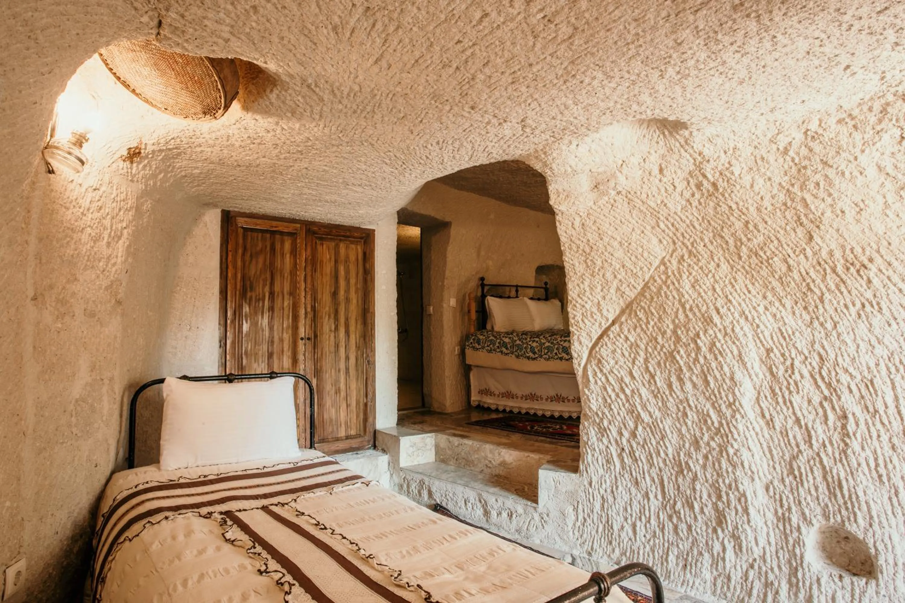 Bed in Village Cave House Hotel