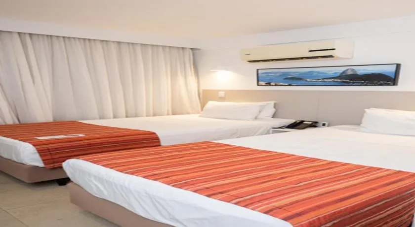 Bed in Ramada by Wyndham Macae Hotel &amp; Suites