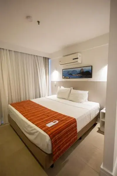 air conditioner, Bed in Ramada by Wyndham Macae Hotel & Suites air conditioner, Bed in Ramada by Wyndham Macae Hotel & Suites