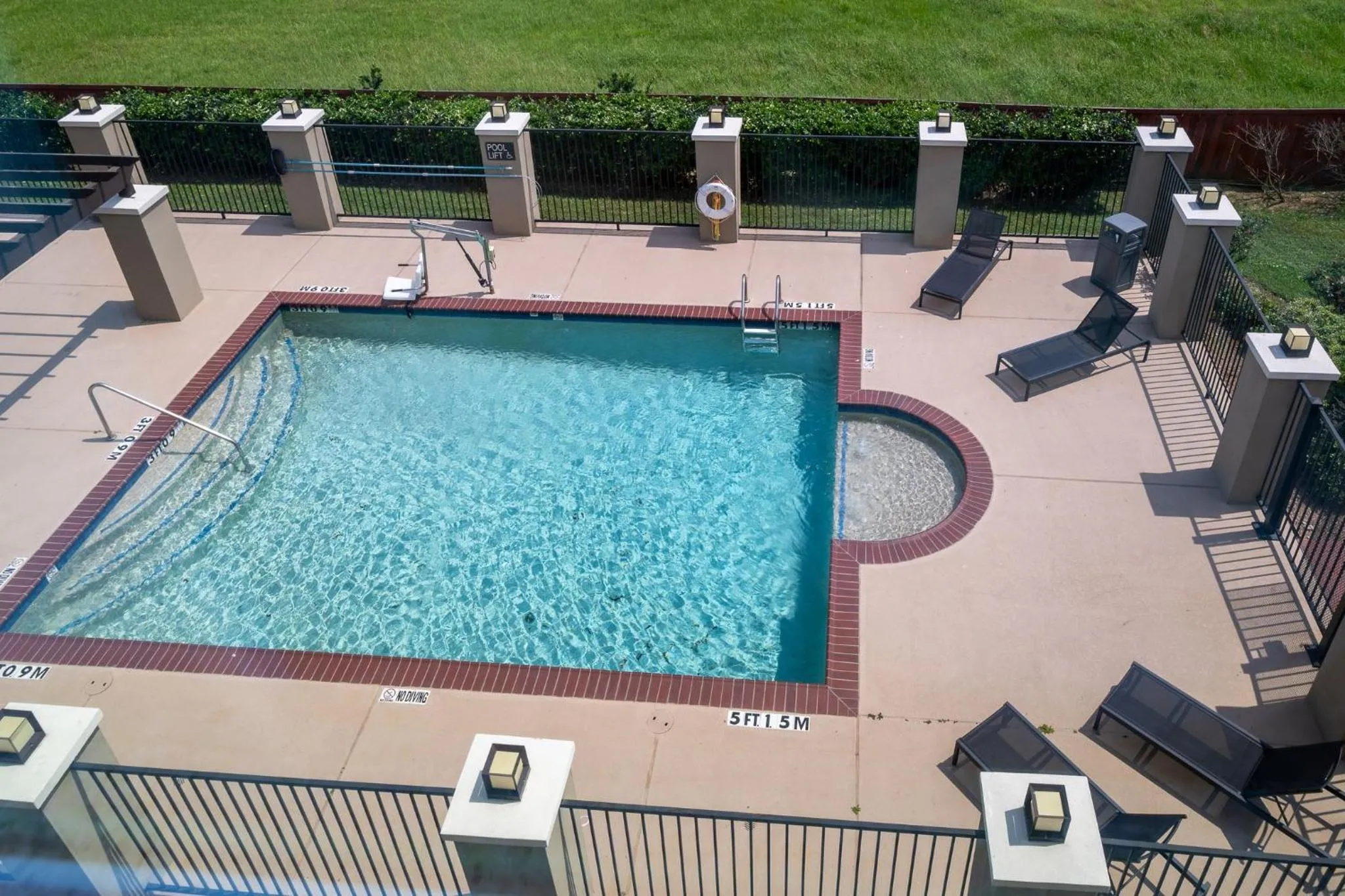 Swimming pool in Candlewood Suites Deer Park by IHG