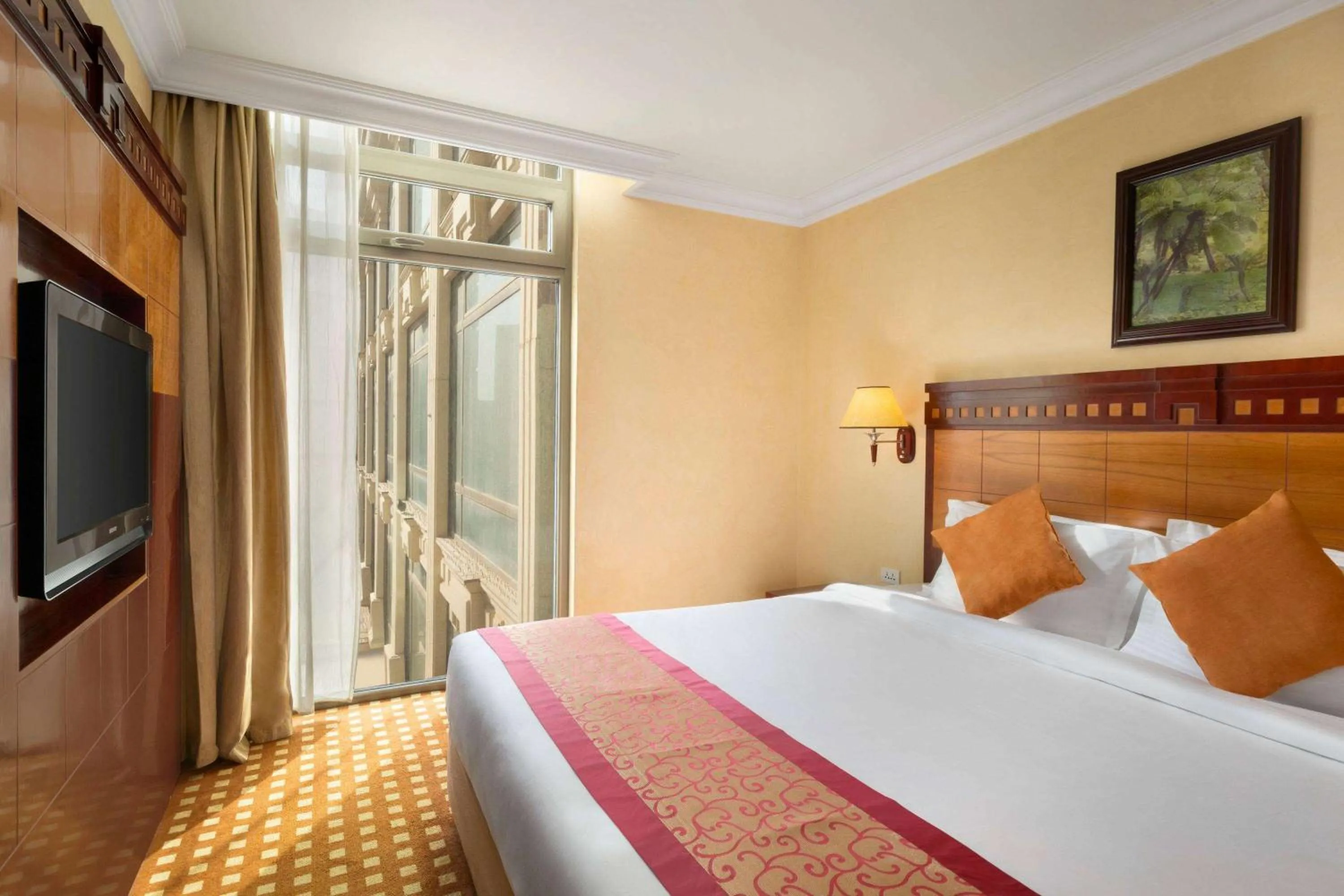 Bed in Ramada Riyadh Hotel