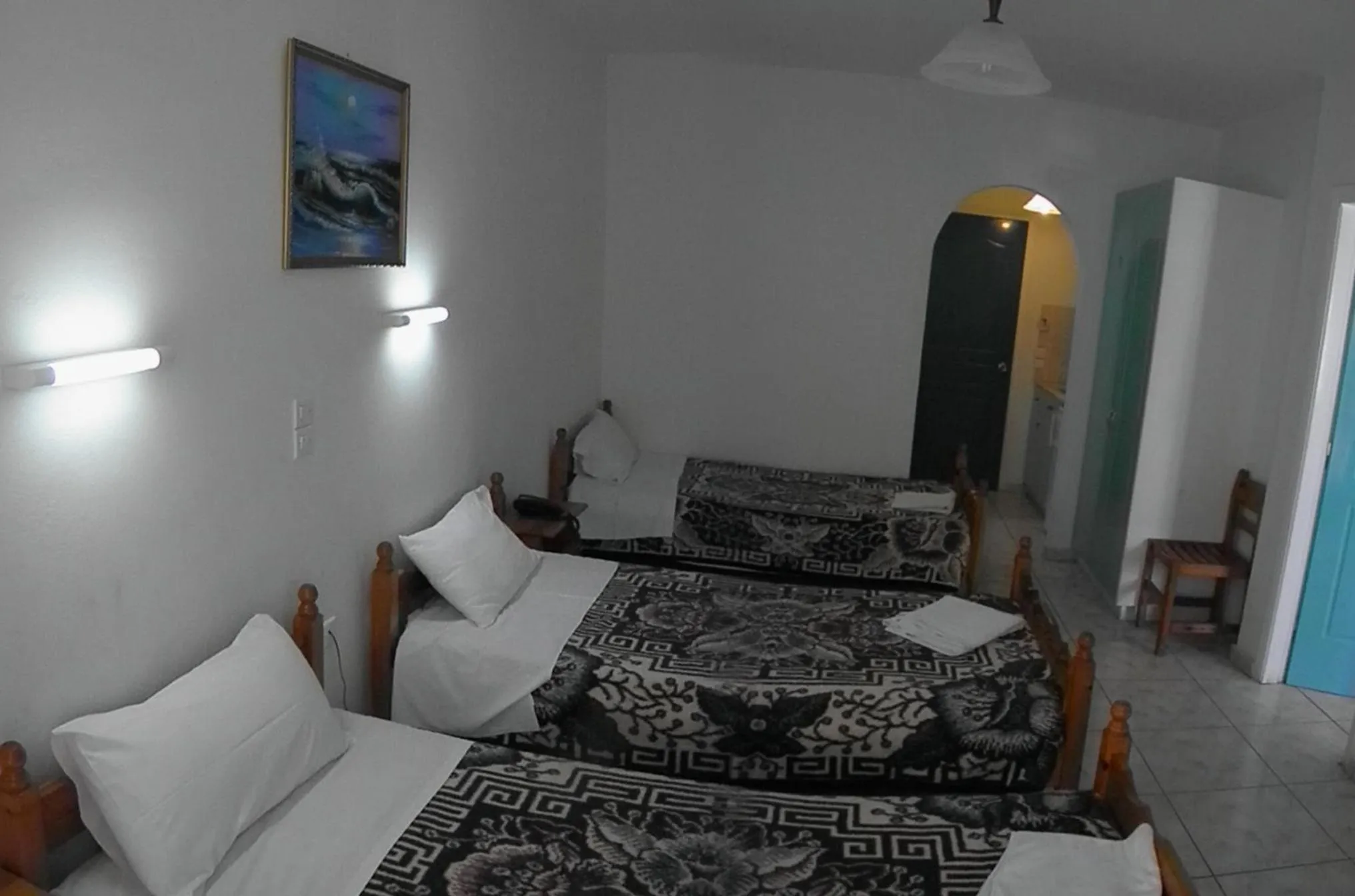 Bed in Vossos Hotel Apartments
