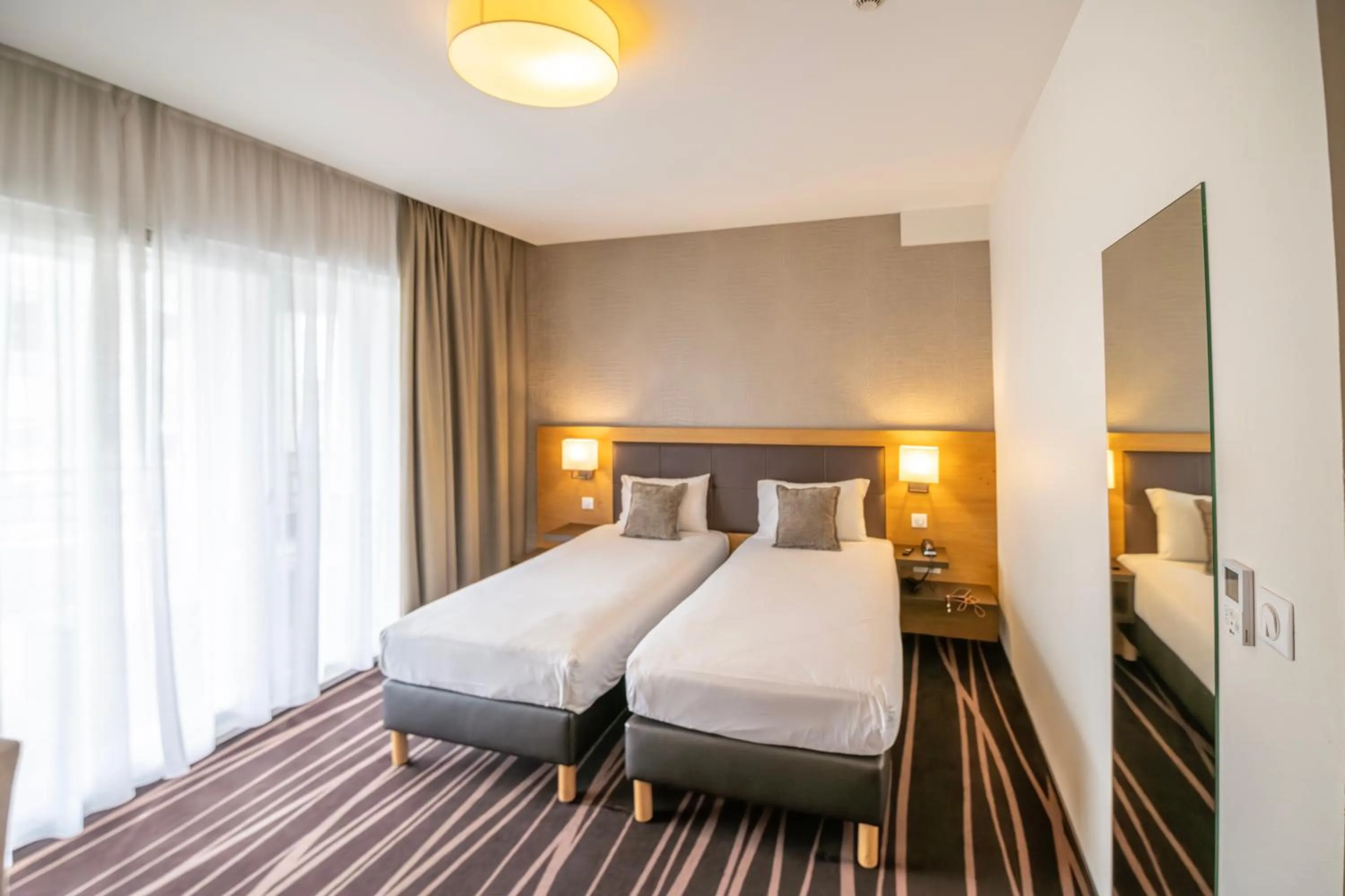 Photo of the whole room, Bed in Le Lodge Brit Hotel Strasbourg Zenith