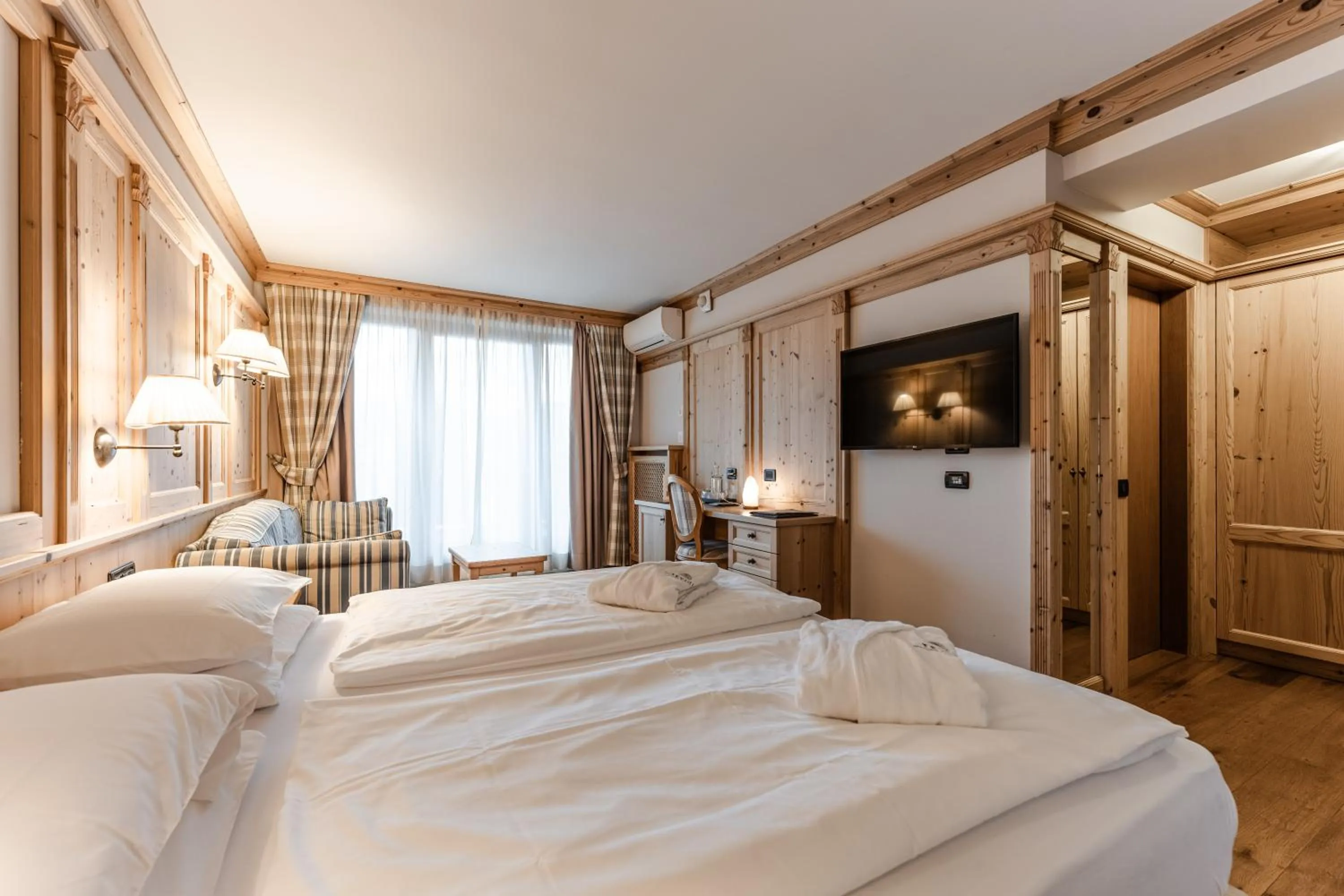 Bed in Tevini Dolomites Charming Hotel