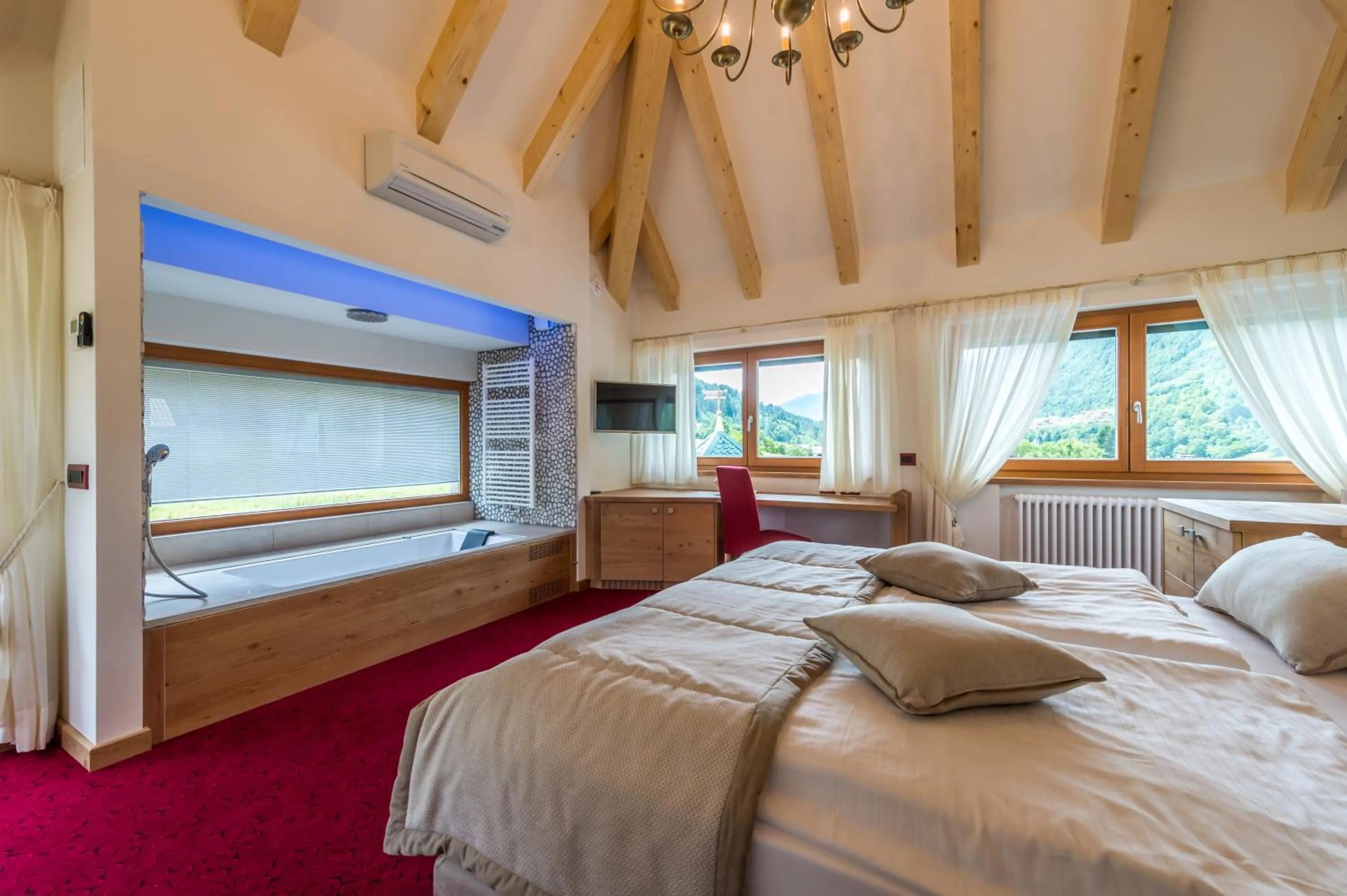 Photo of the whole room, Bed in Tevini Dolomites Charming Hotel