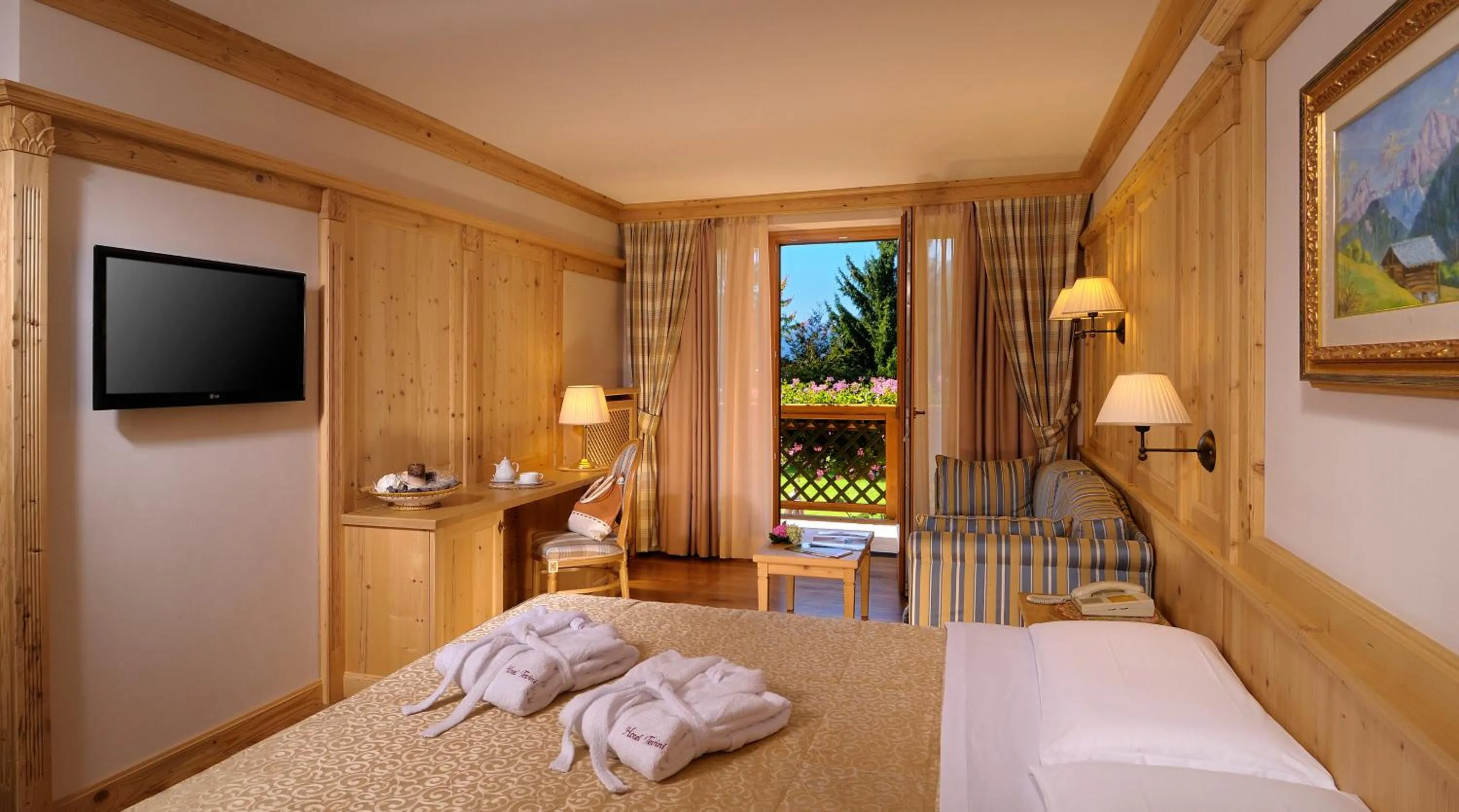 Photo of the whole room, Bed in Tevini Dolomites Charming Hotel