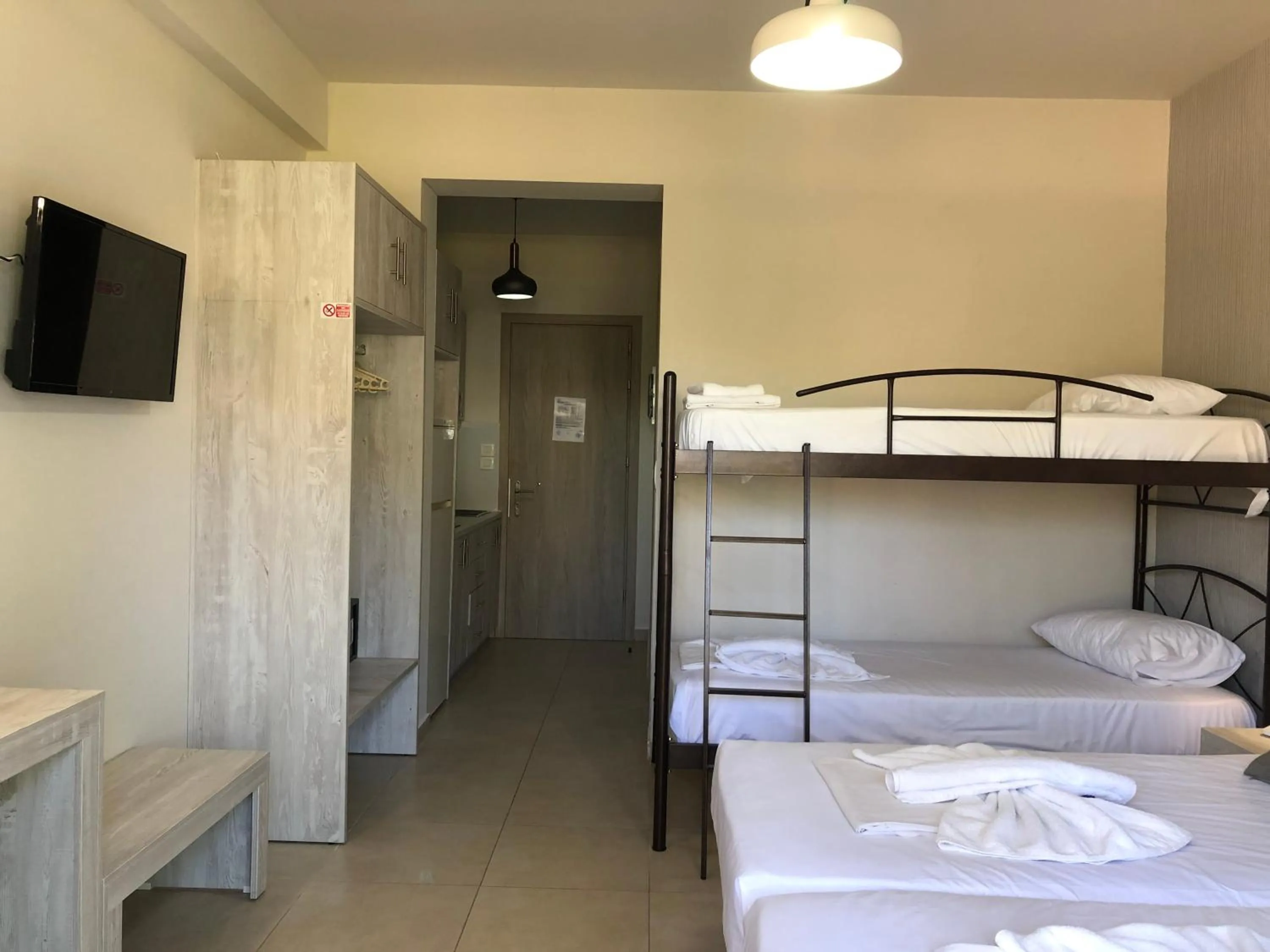 Bed in Paradise Apartments