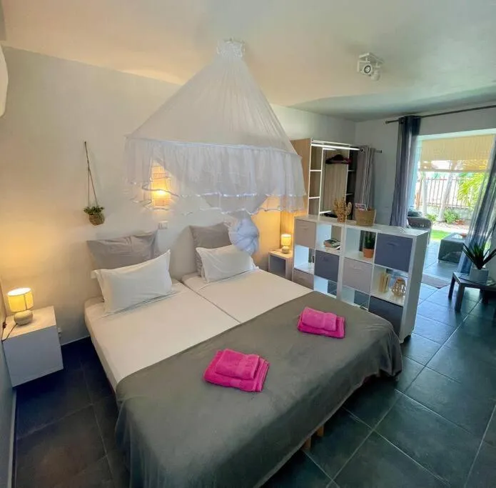 Bed in Bungalow Coco résidence Ti-Figues