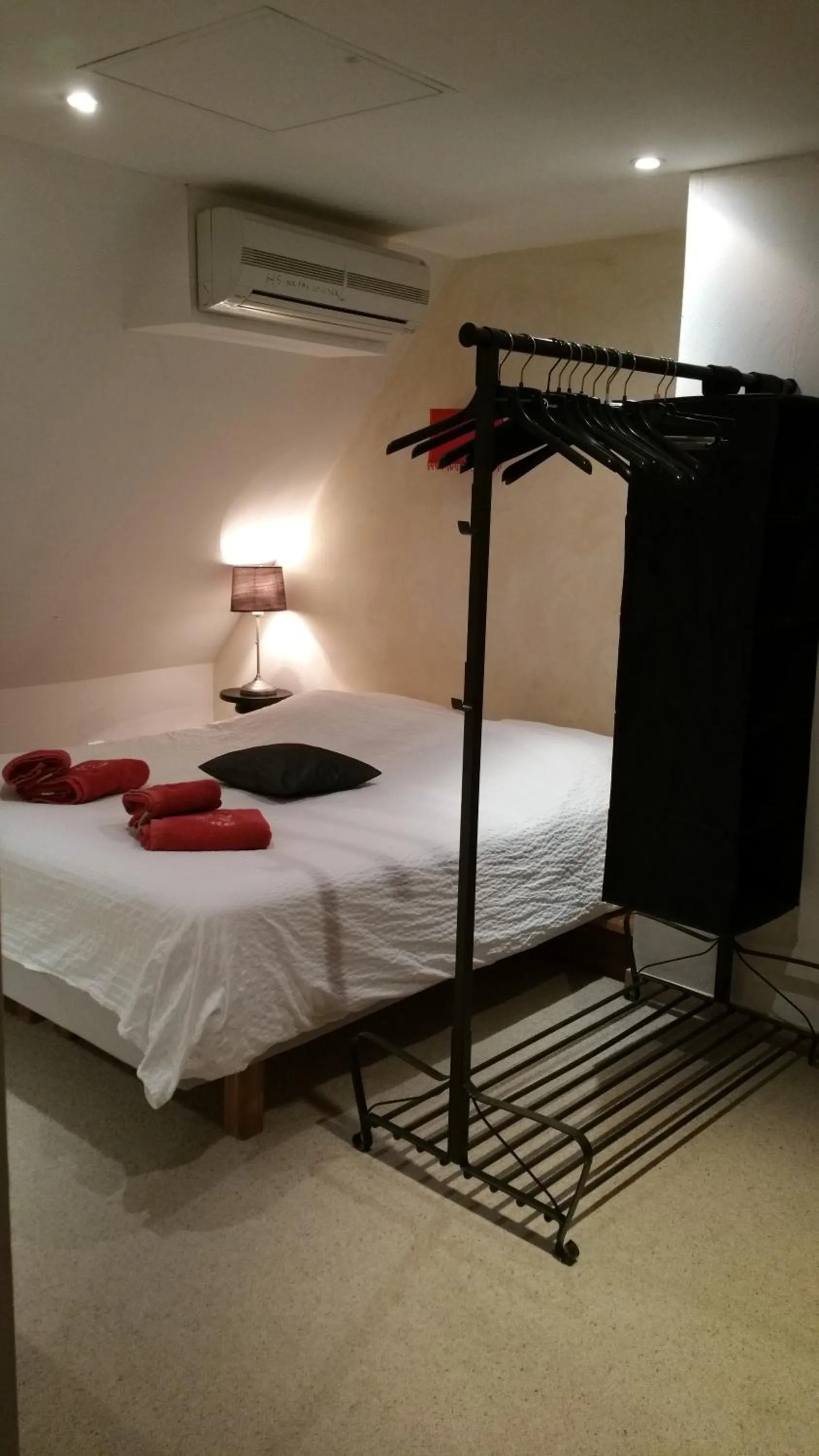 Quadruple Room in Chambres touristiques La Cour Des Hôtes