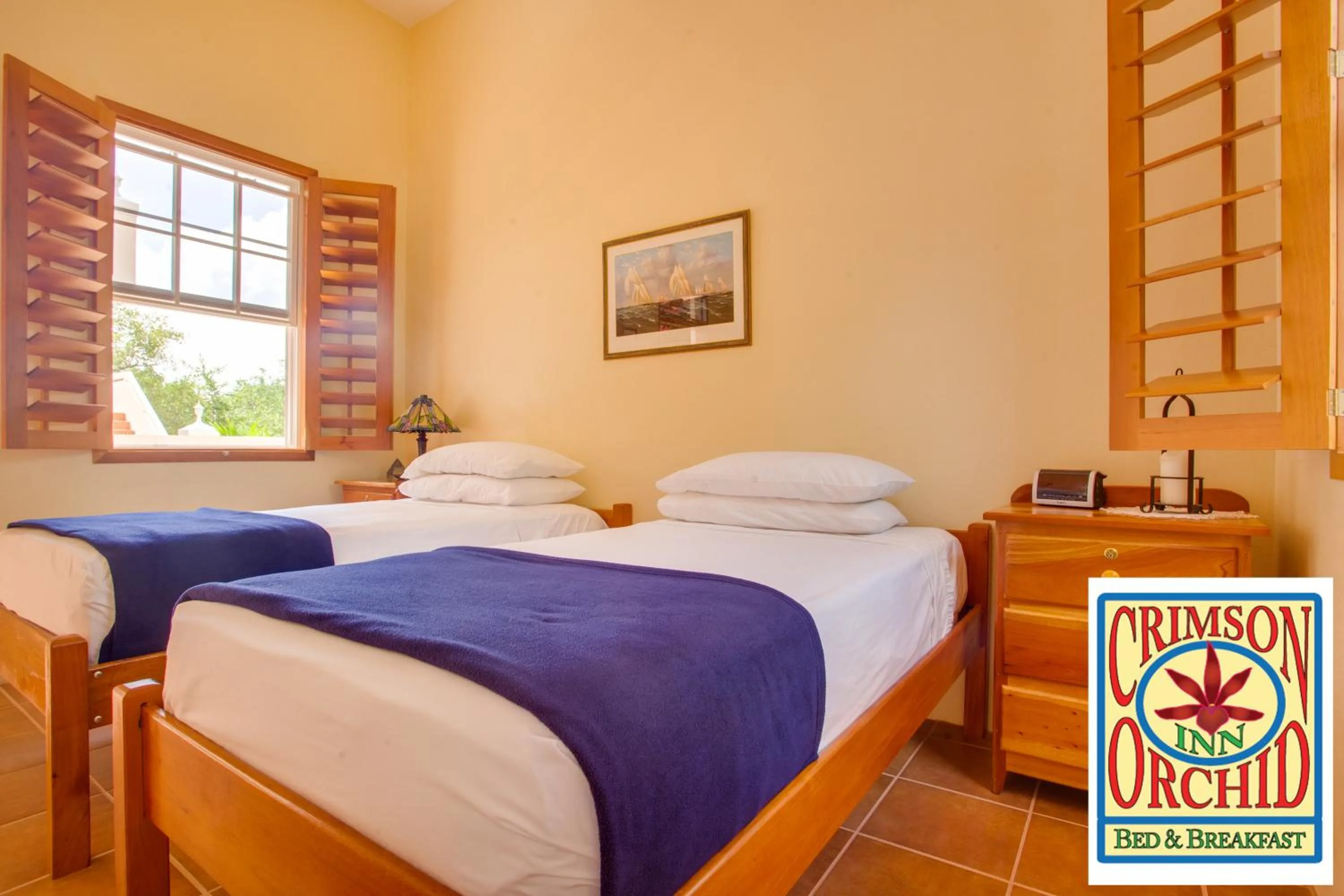 Bed in The Crimson Orchid Inn at Orchid Bay