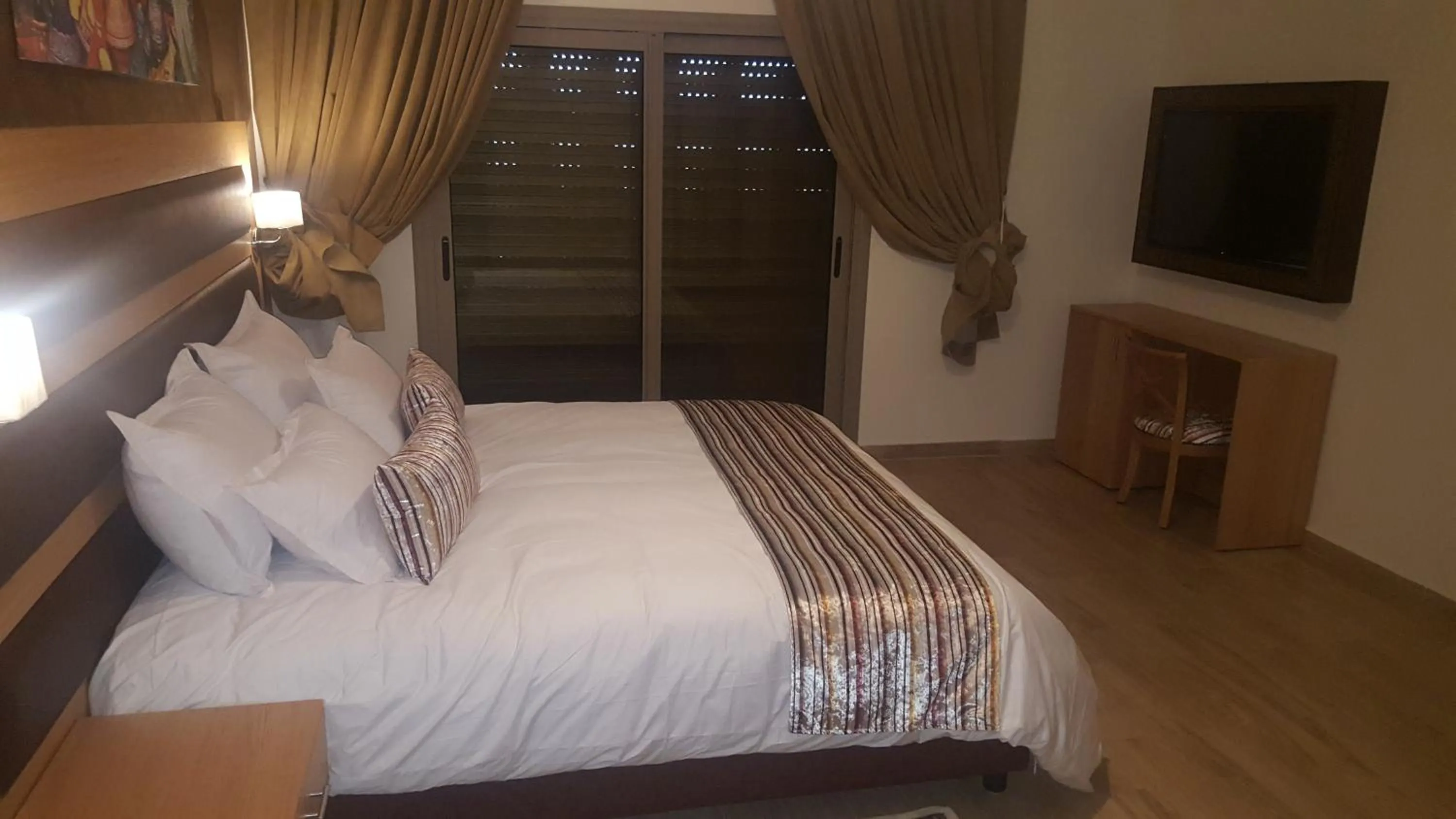 Seating area, Bed in Rofaida Appart'Hotel