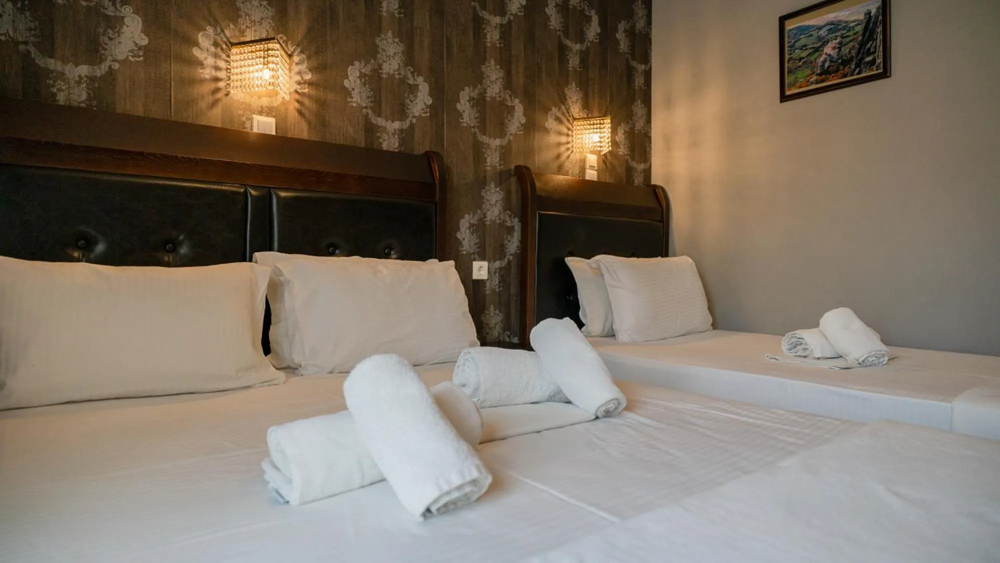 Bed in Toti Boutique Rooms