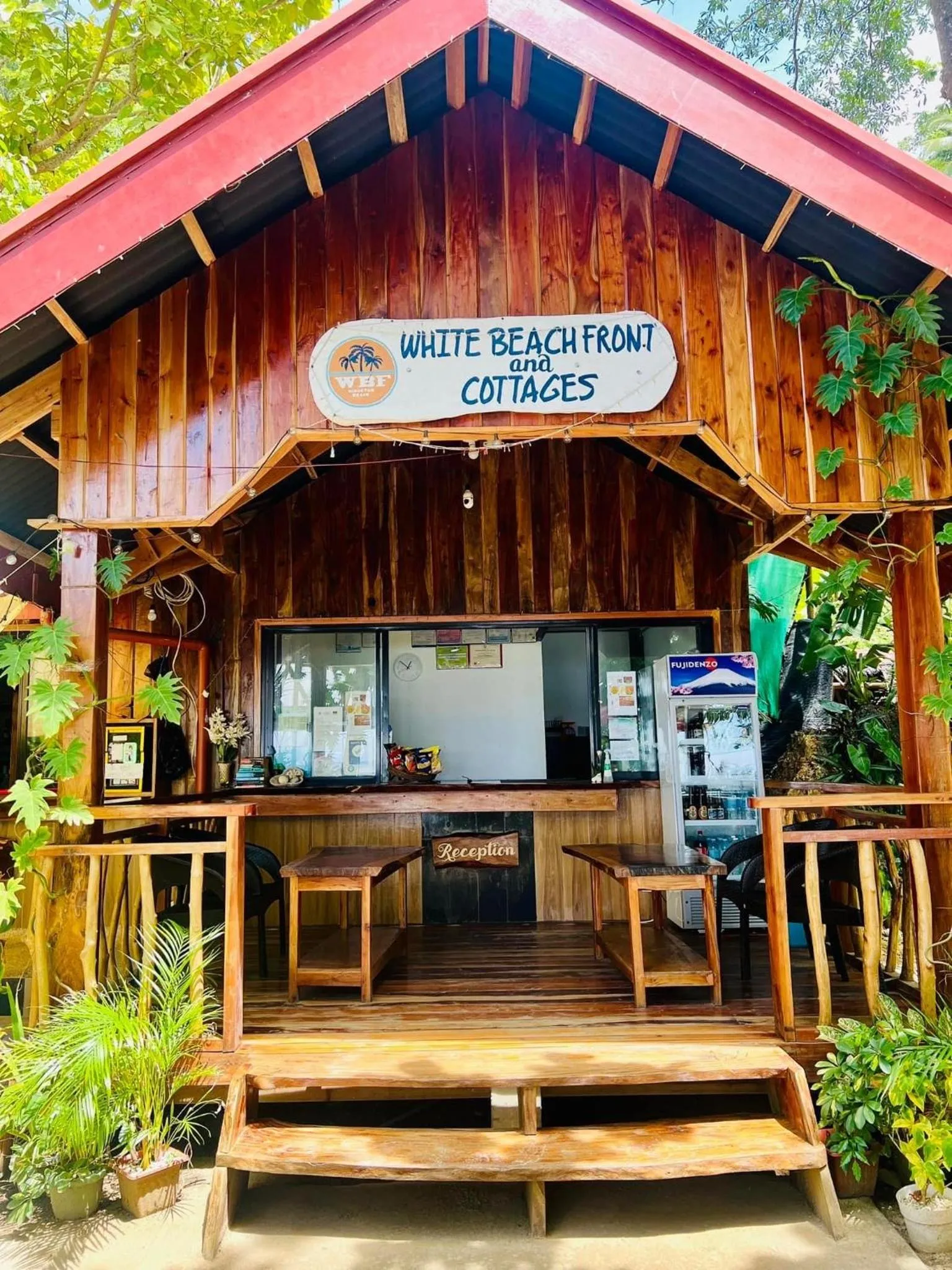 Property logo or sign in White Beach Front and Cottages