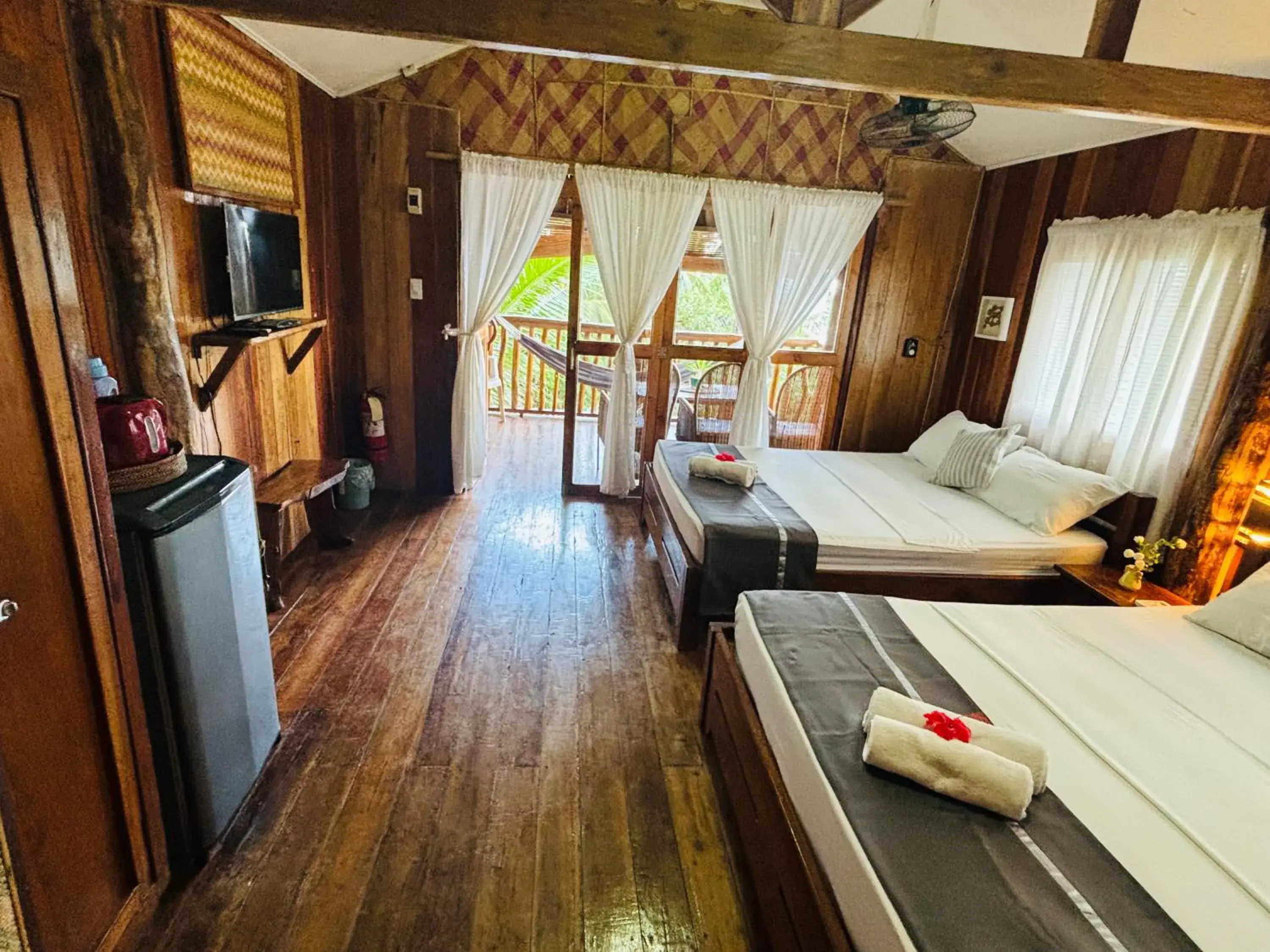 Property building, Bed in White Beach Front and Cottages Property building, Bed in White Beach Front and Cottages