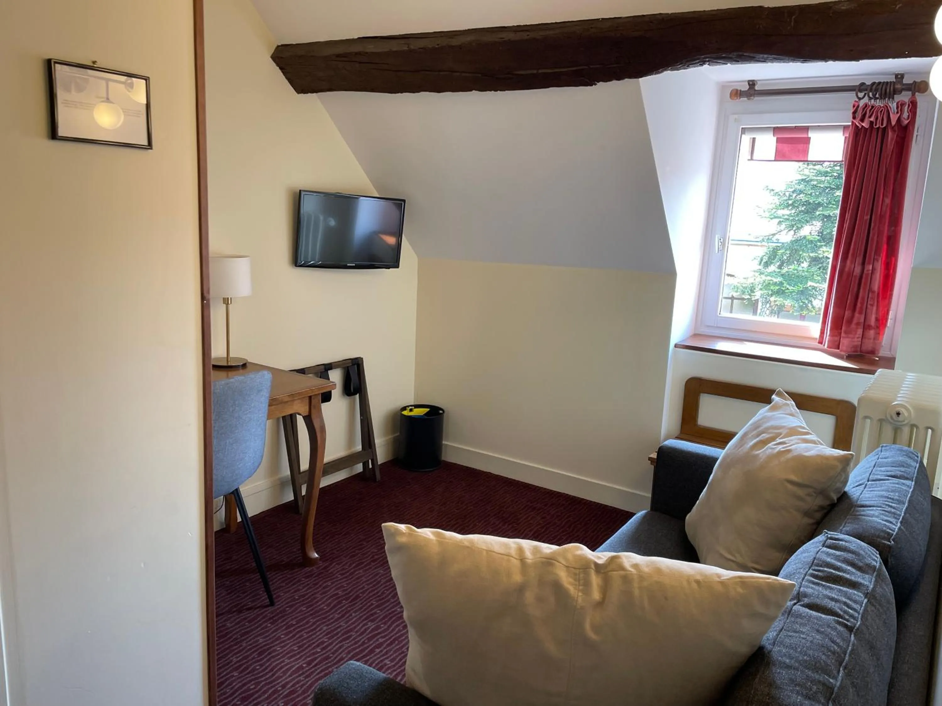 Bedroom in Logis Hôtel Le Saint Florent