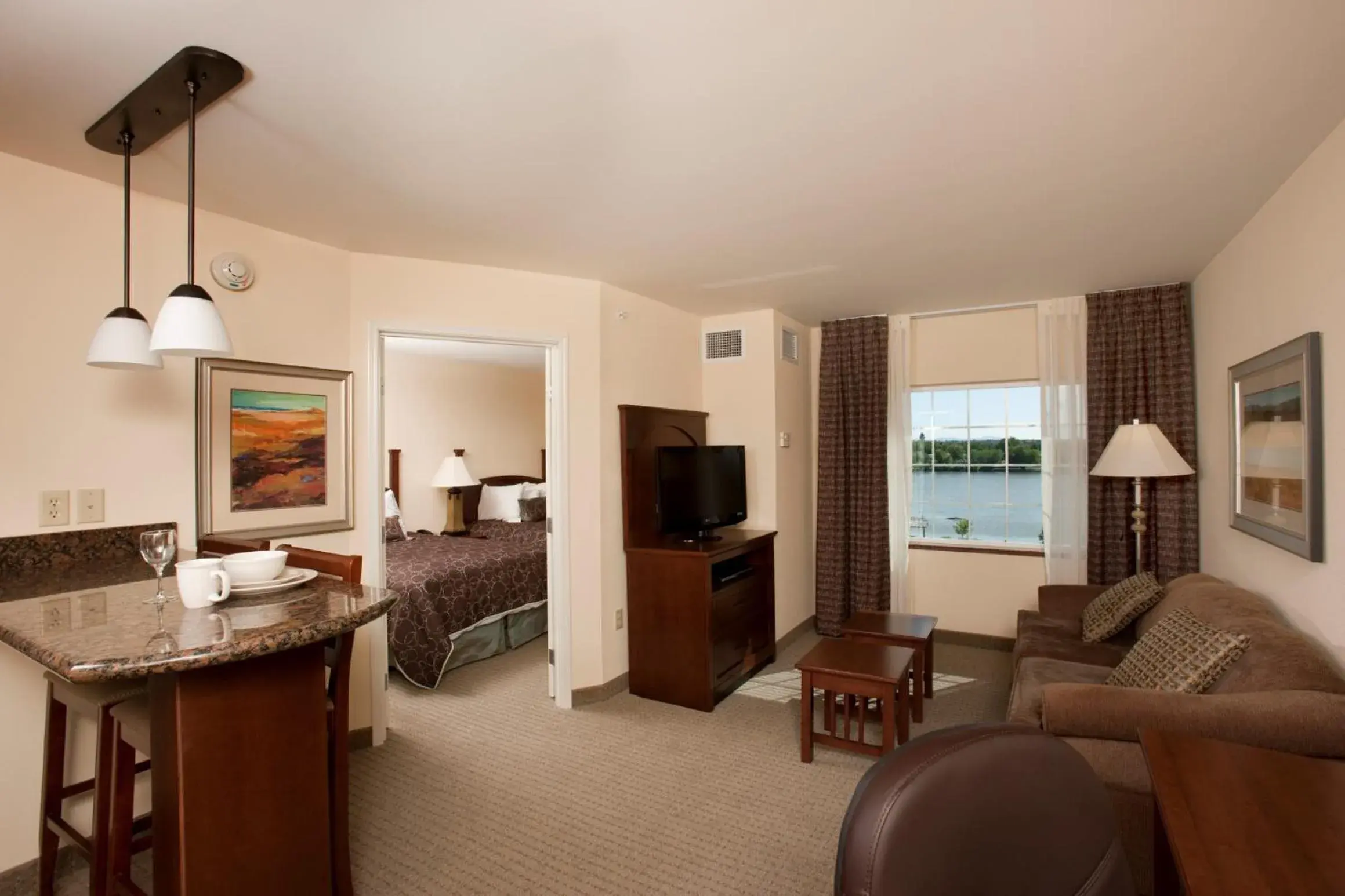 Living room, Bed in Staybridge Suites Great Falls by IHG Living room, Bed in Staybridge Suites Great Falls by IHG