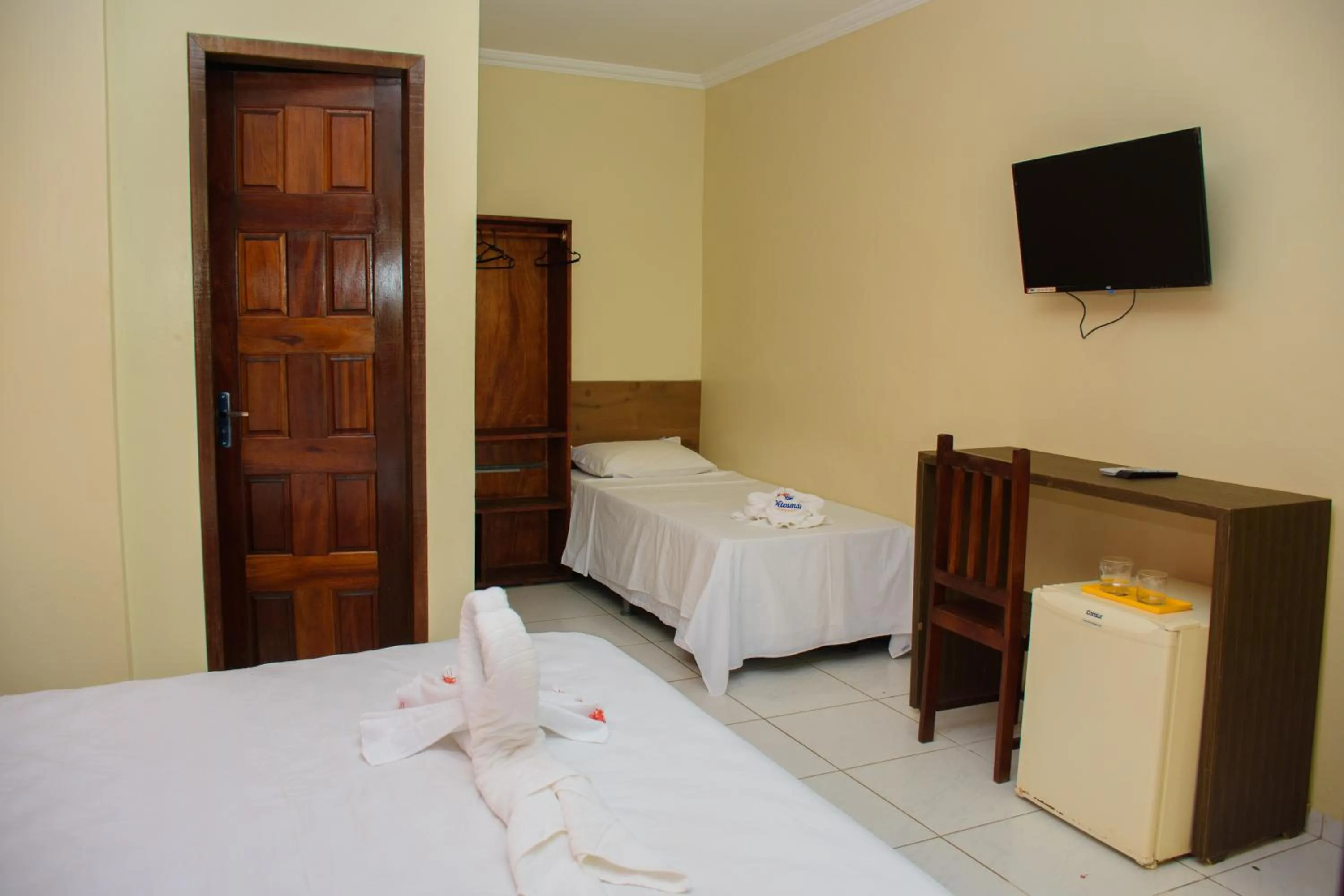 Bed in Pousada Velosmar