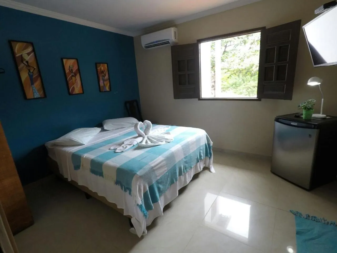 Bed in Pousada Velosmar