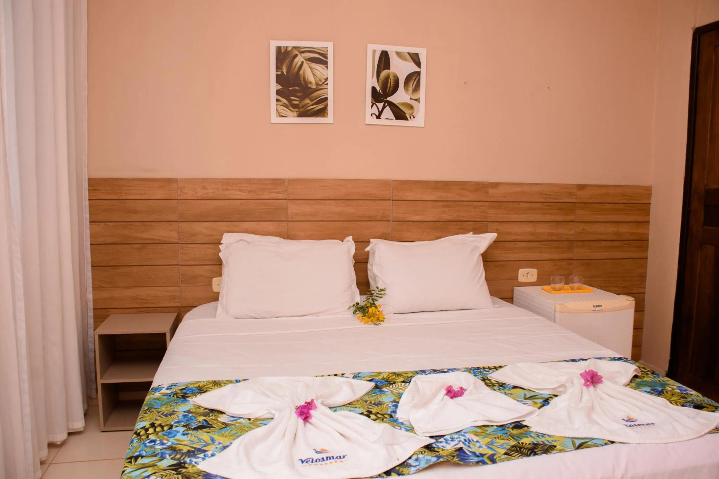 Bed in Pousada Velosmar