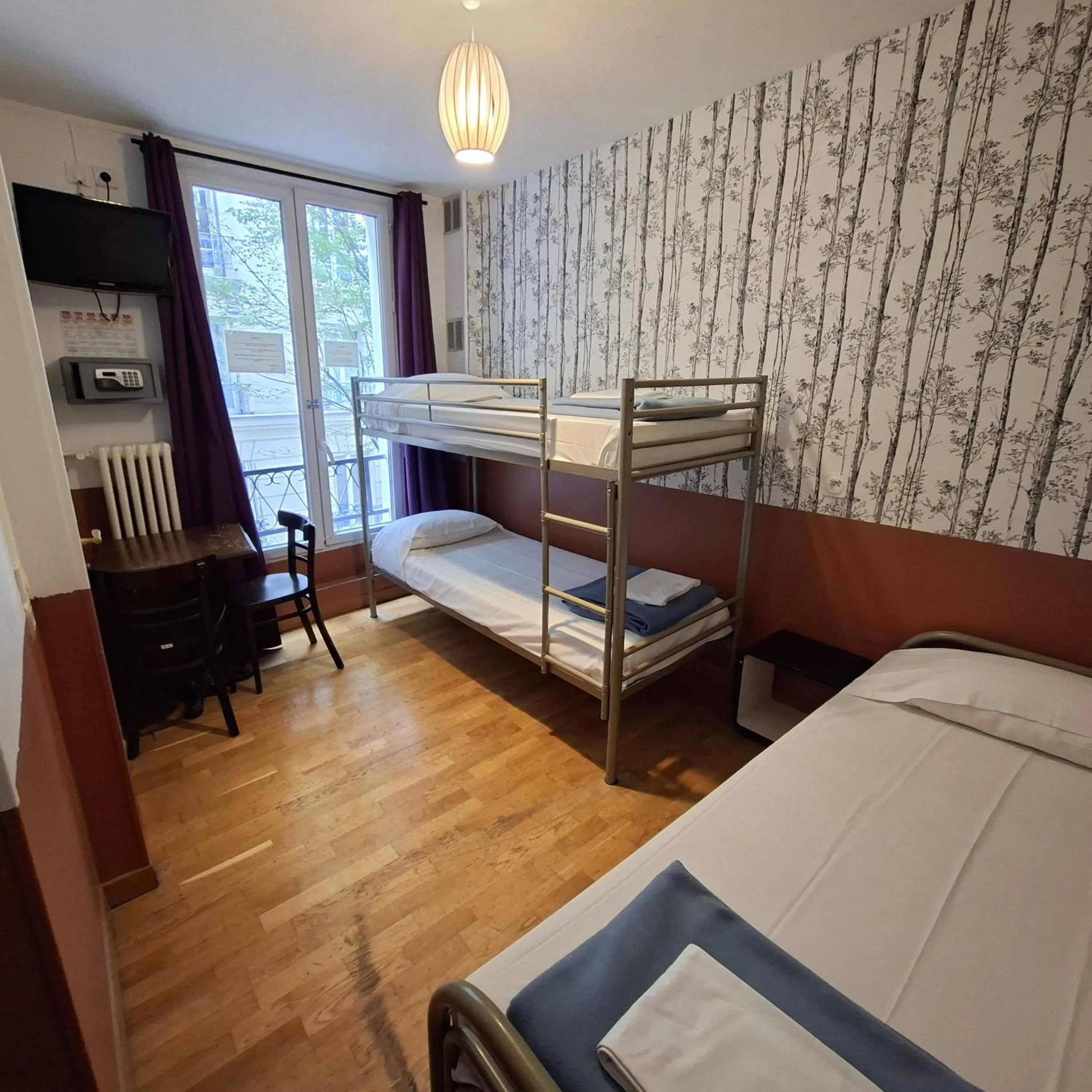 Photo of the whole room, Bed in Caulaincourt Montmartre by Hiphophostels