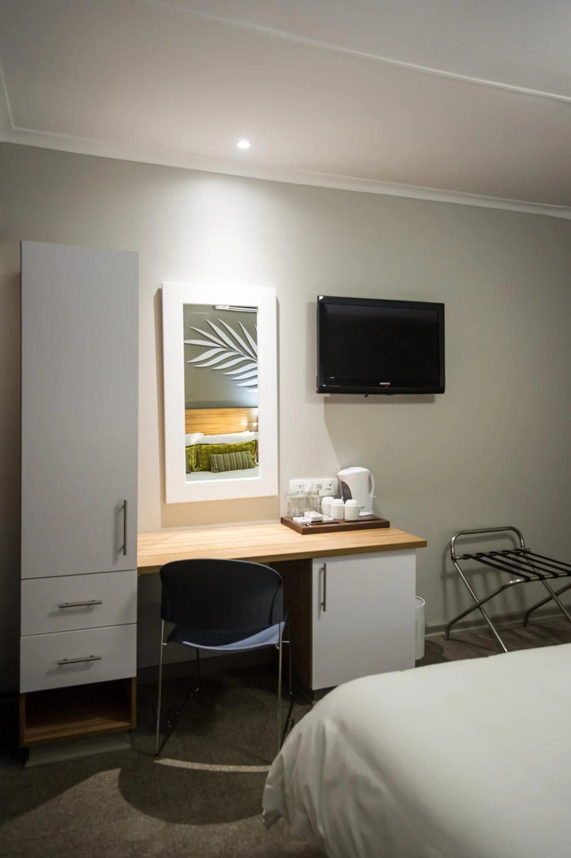 Seating area, Bed in Palm Lodge Guest House