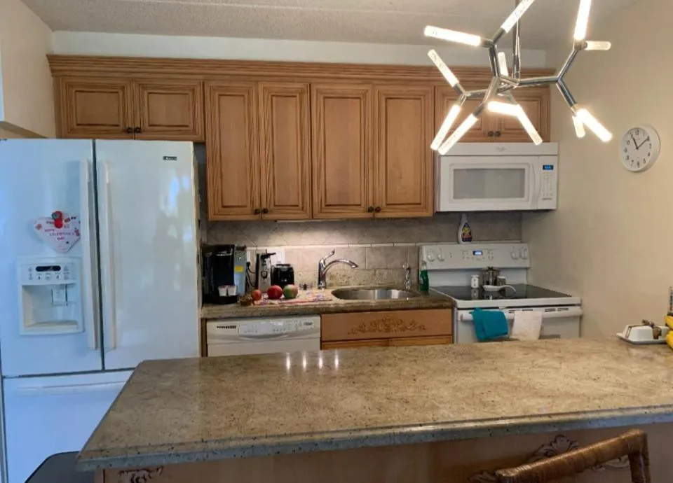 Kitchen or kitchenette in Kihei Kai Nani with a ocean view