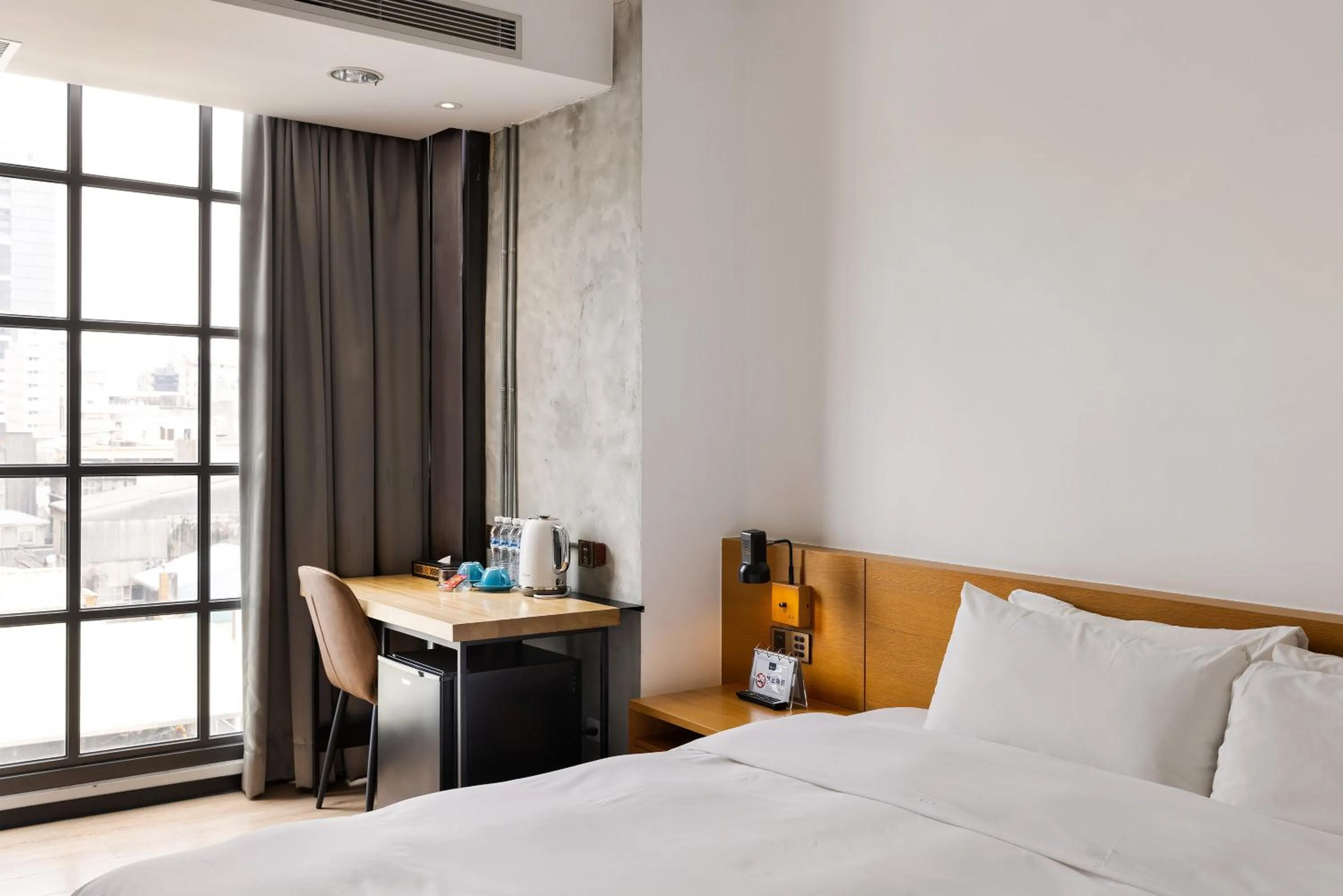 Bed in BlueSky Hotel