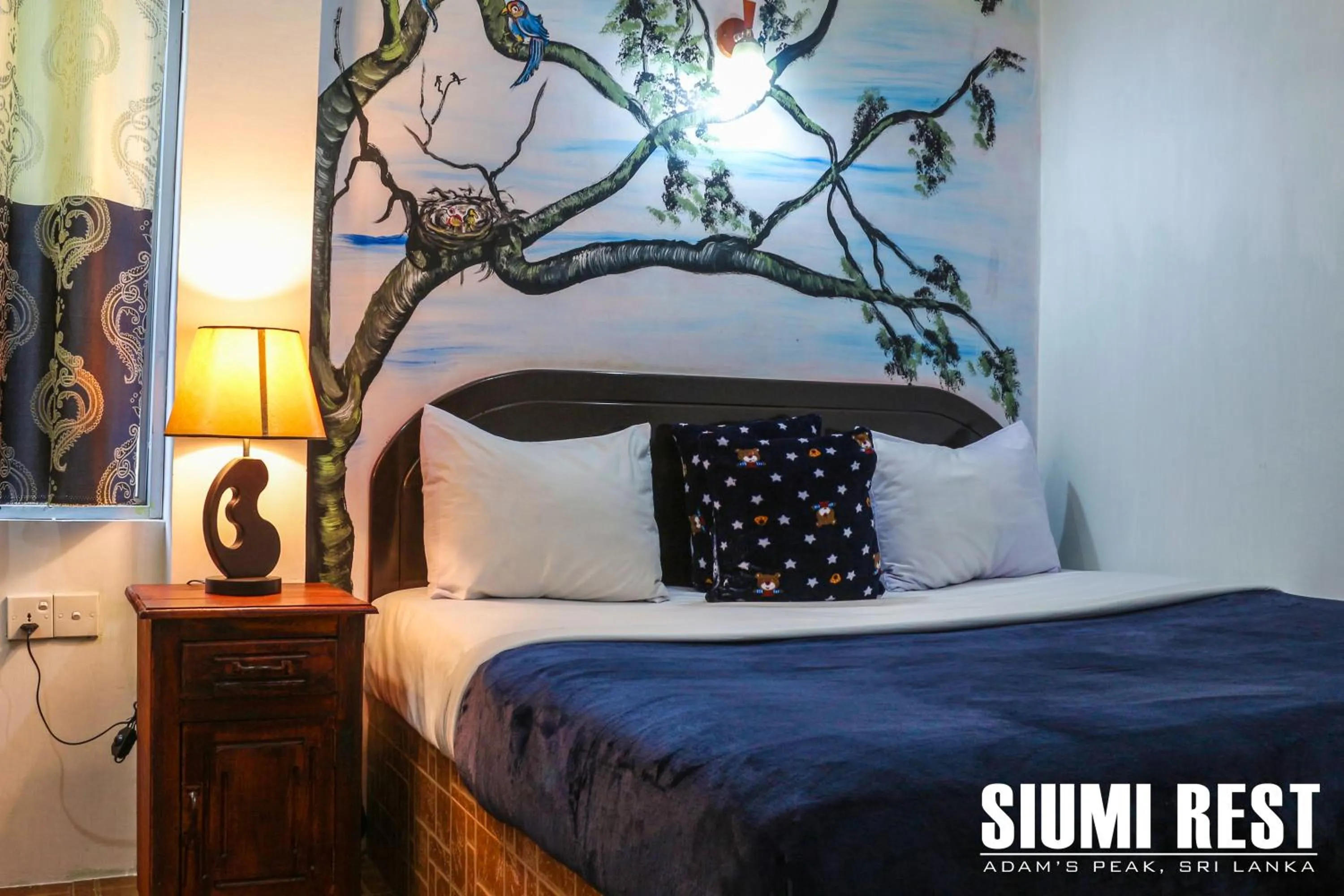 Seating area, Bed in Siumi Rest