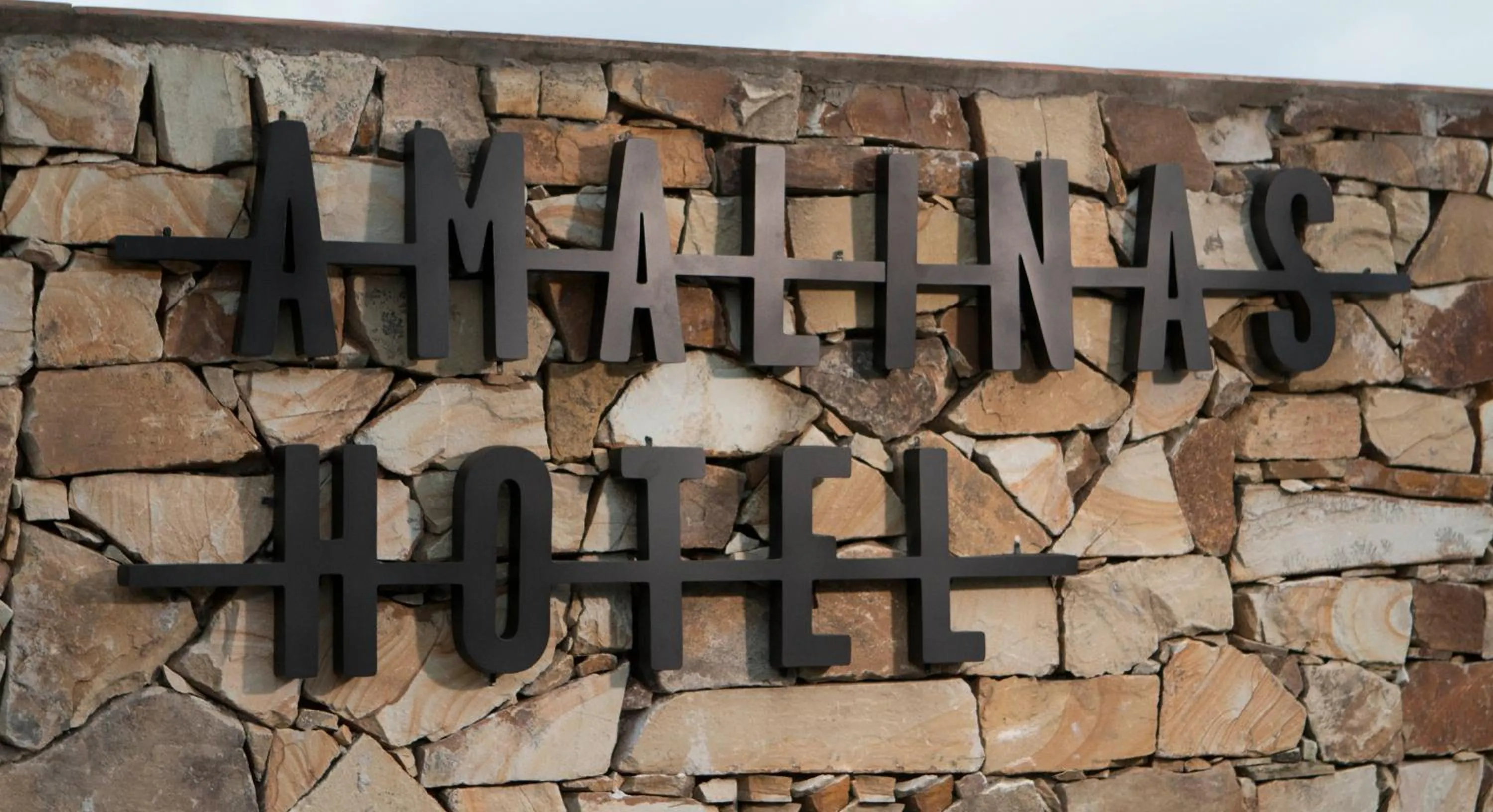 Property logo or sign in Amalinas Hotel