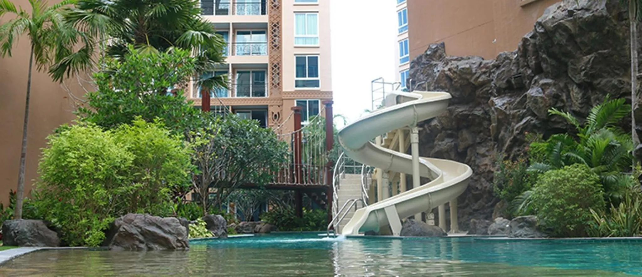 Swimming pool in Atlantic Condo Resort Pattaya by Panisara