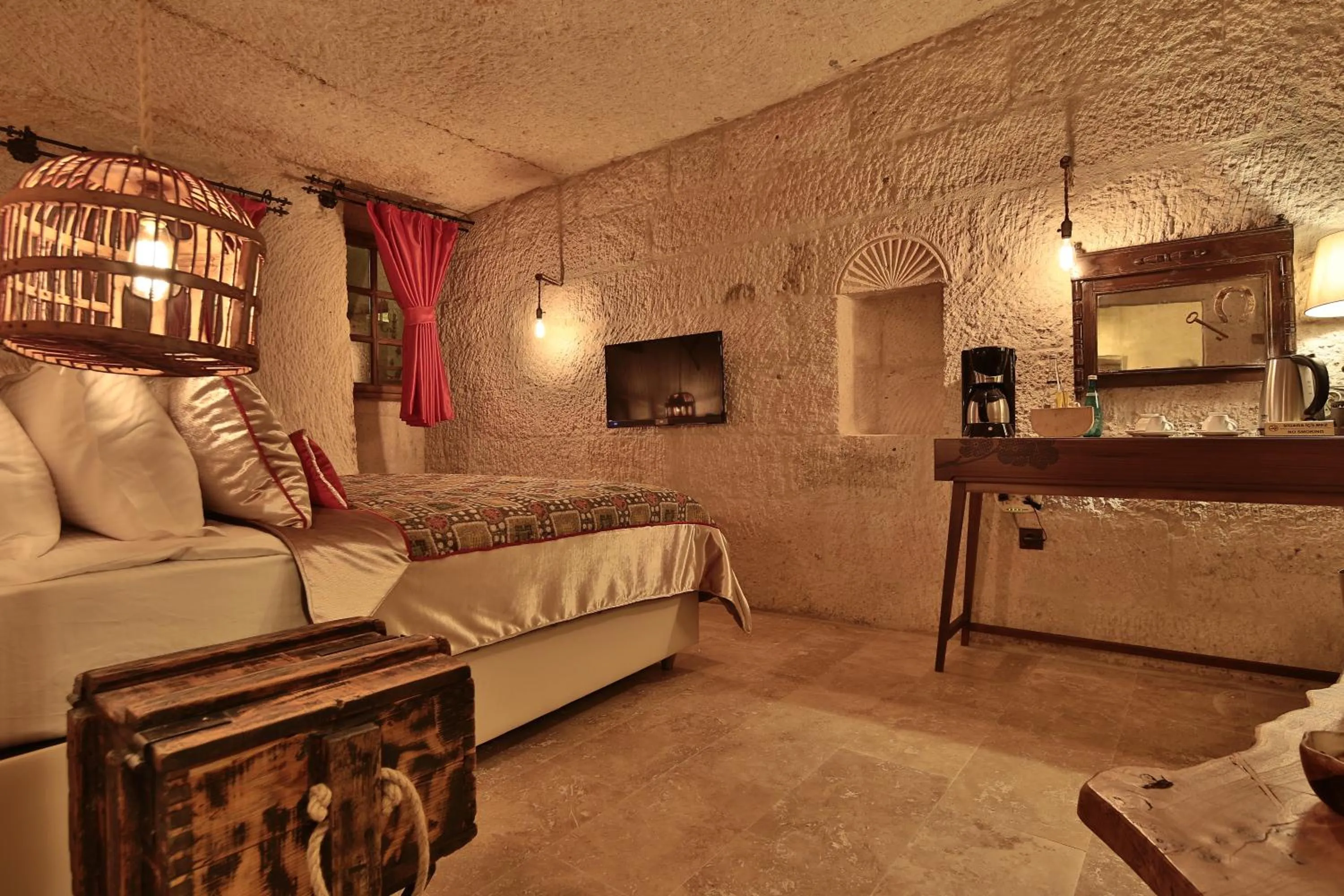 Bed in The Owl Cave Hotel