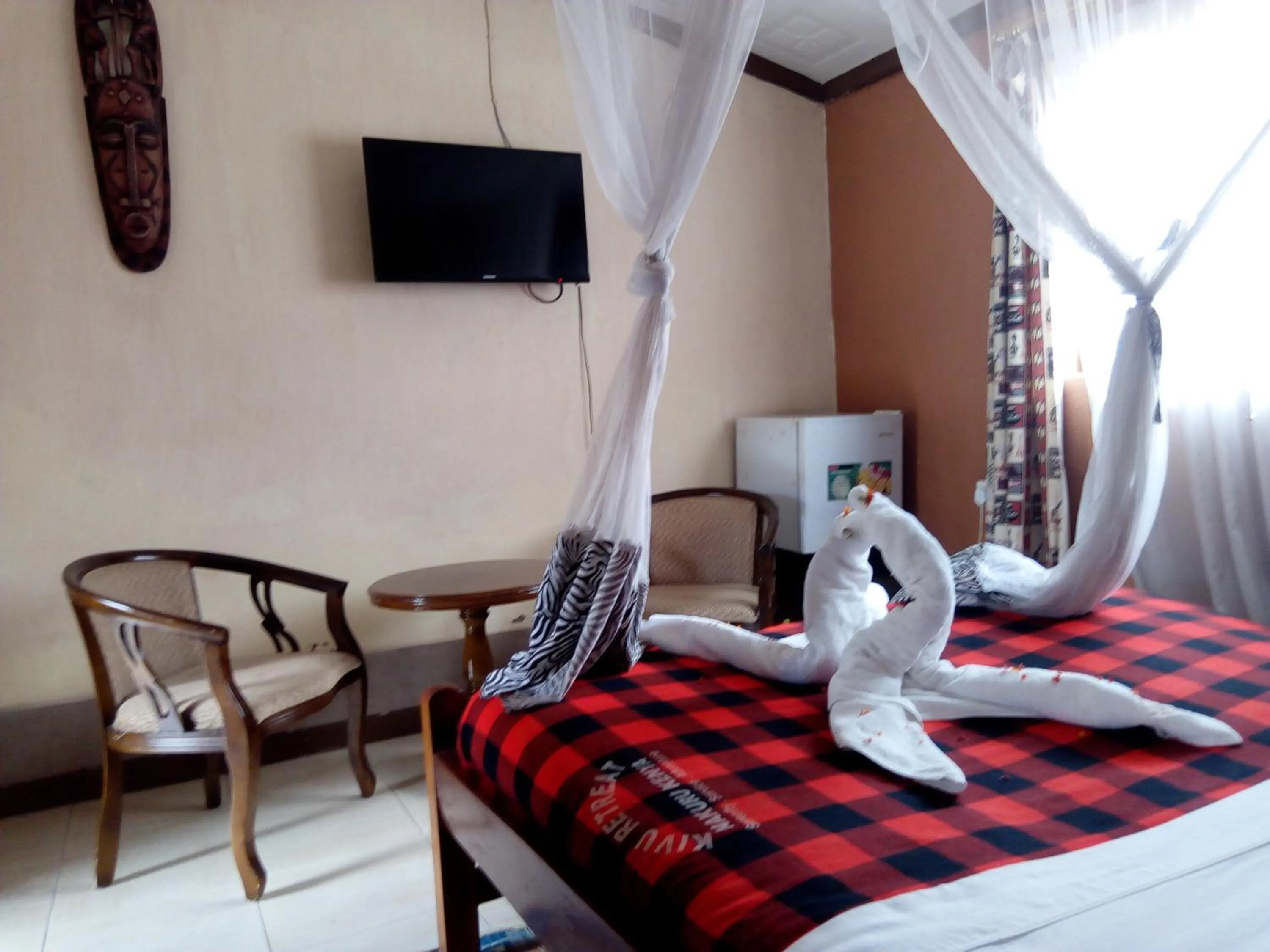 Photo of the whole room, Bed in Kivu Resort