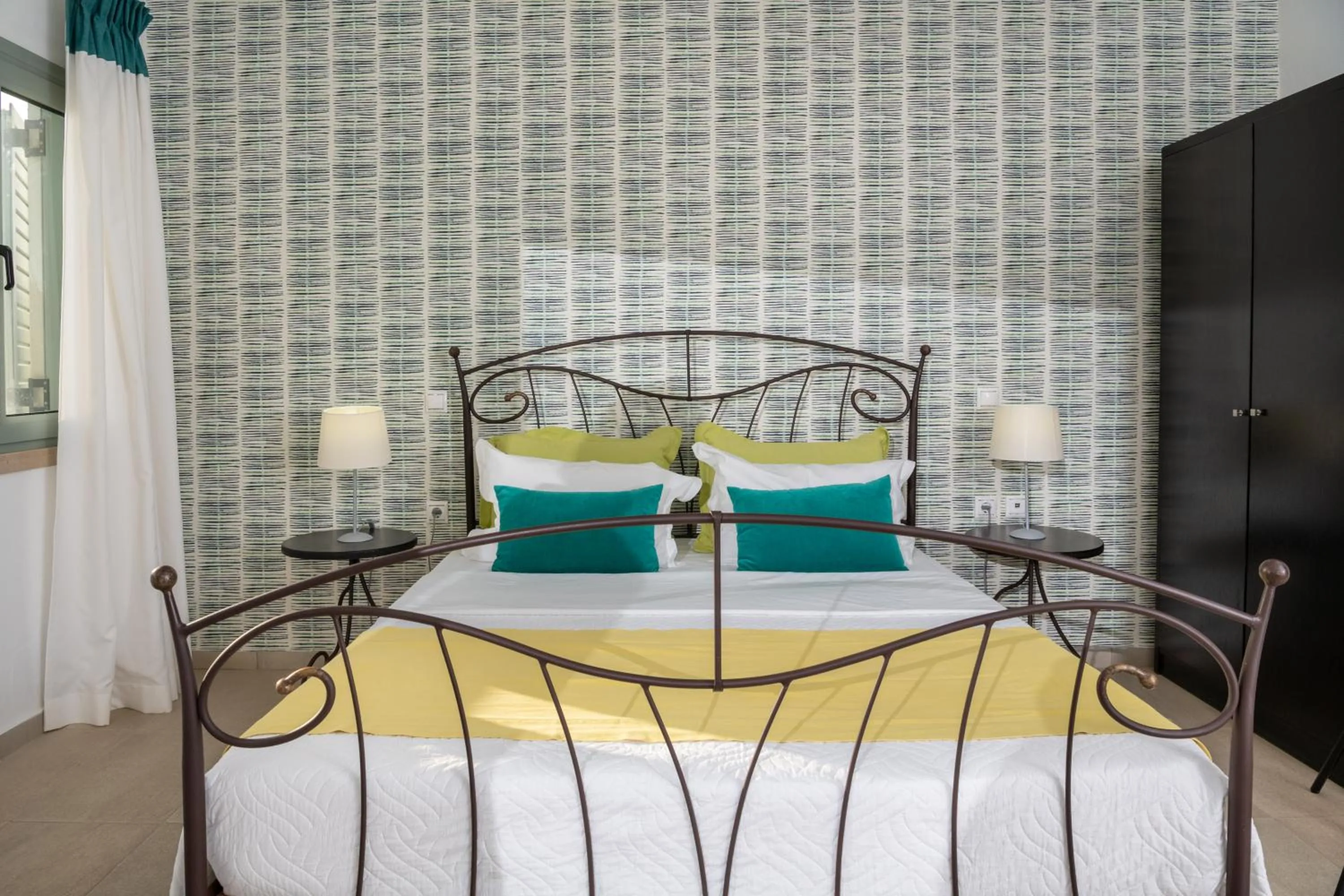 Bed in Angela Studios Apartments