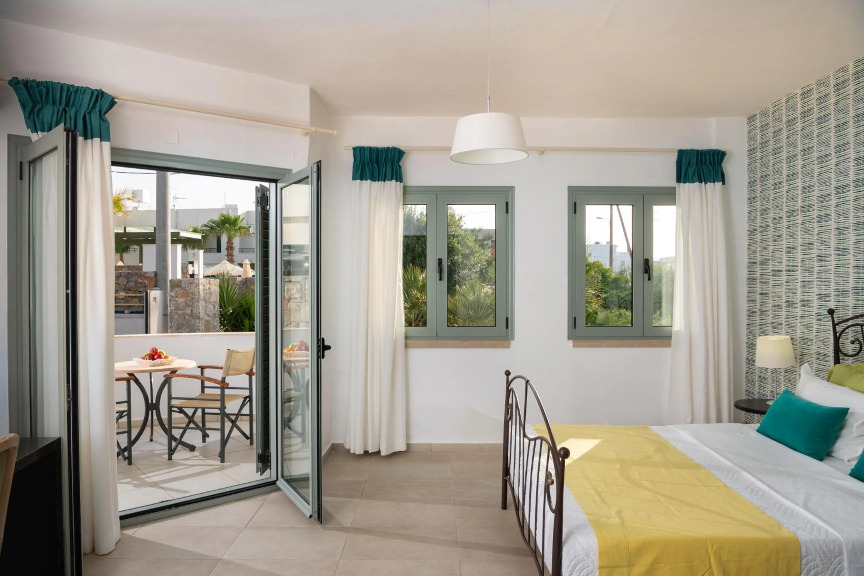 Patio, Bed in Angela Studios Apartments