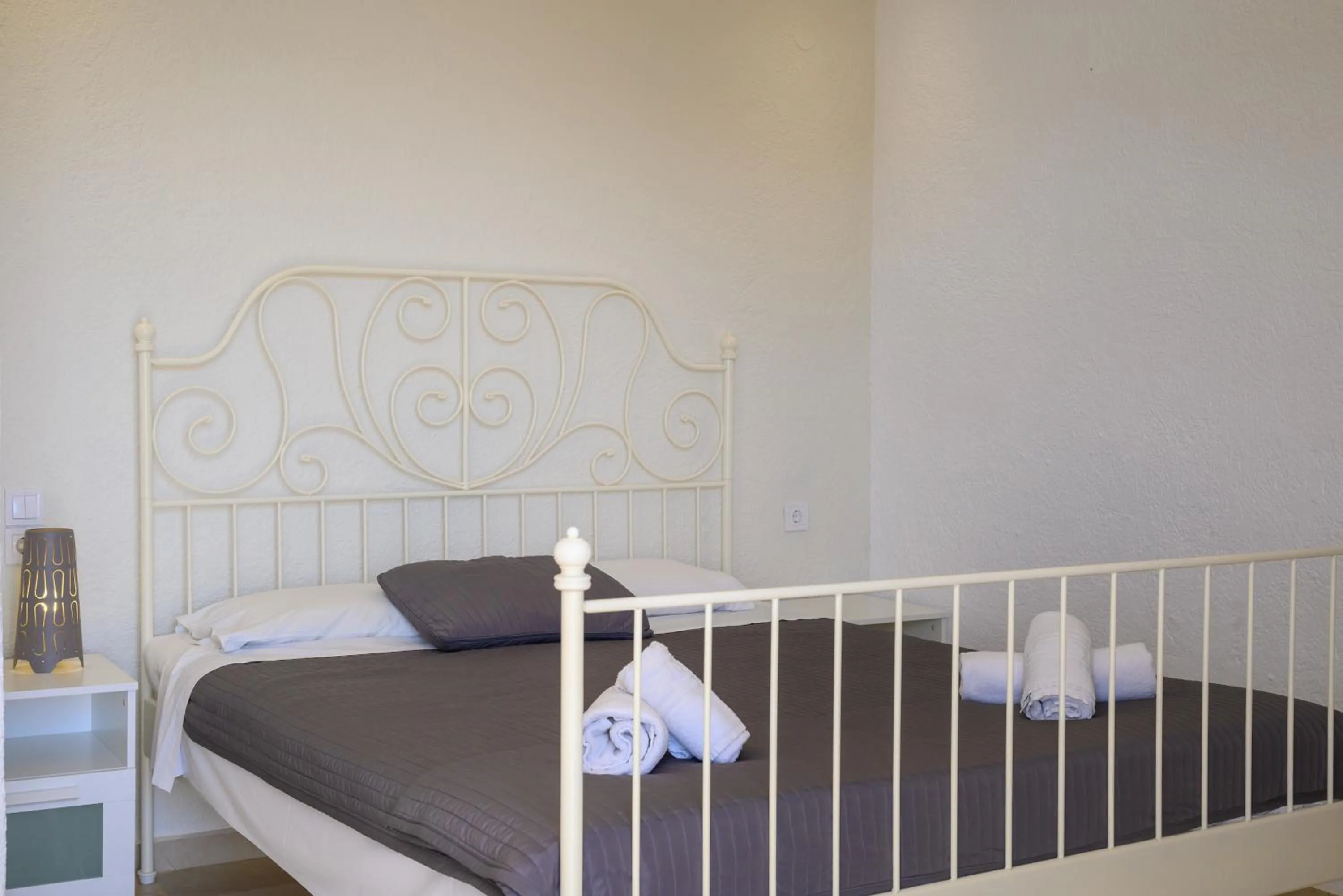 Bed in Havania Apartments