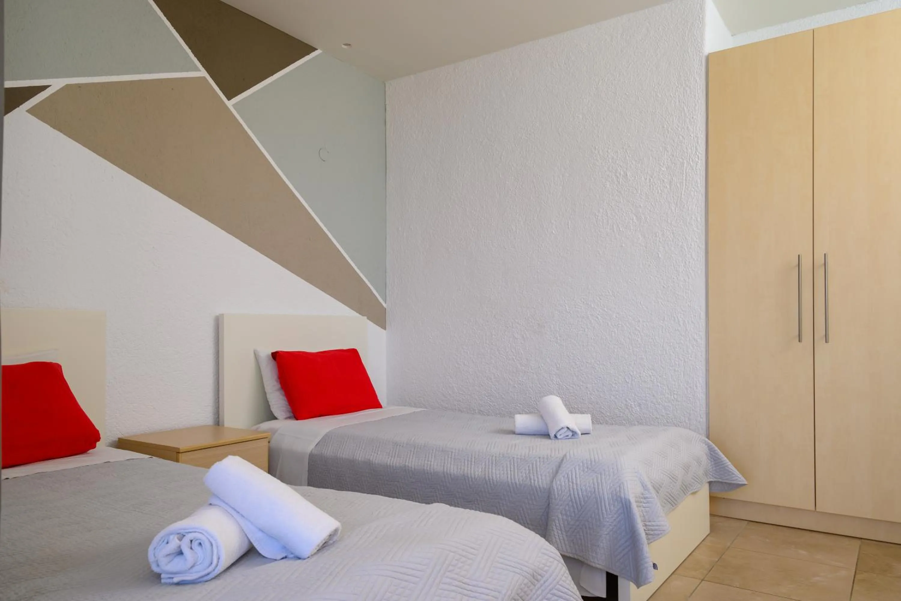Bed in Havania Apartments