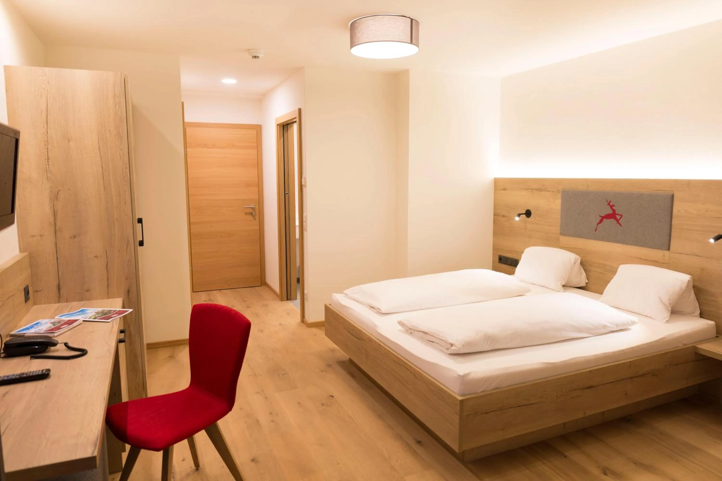 Living room, Bed in Hotel Rosner