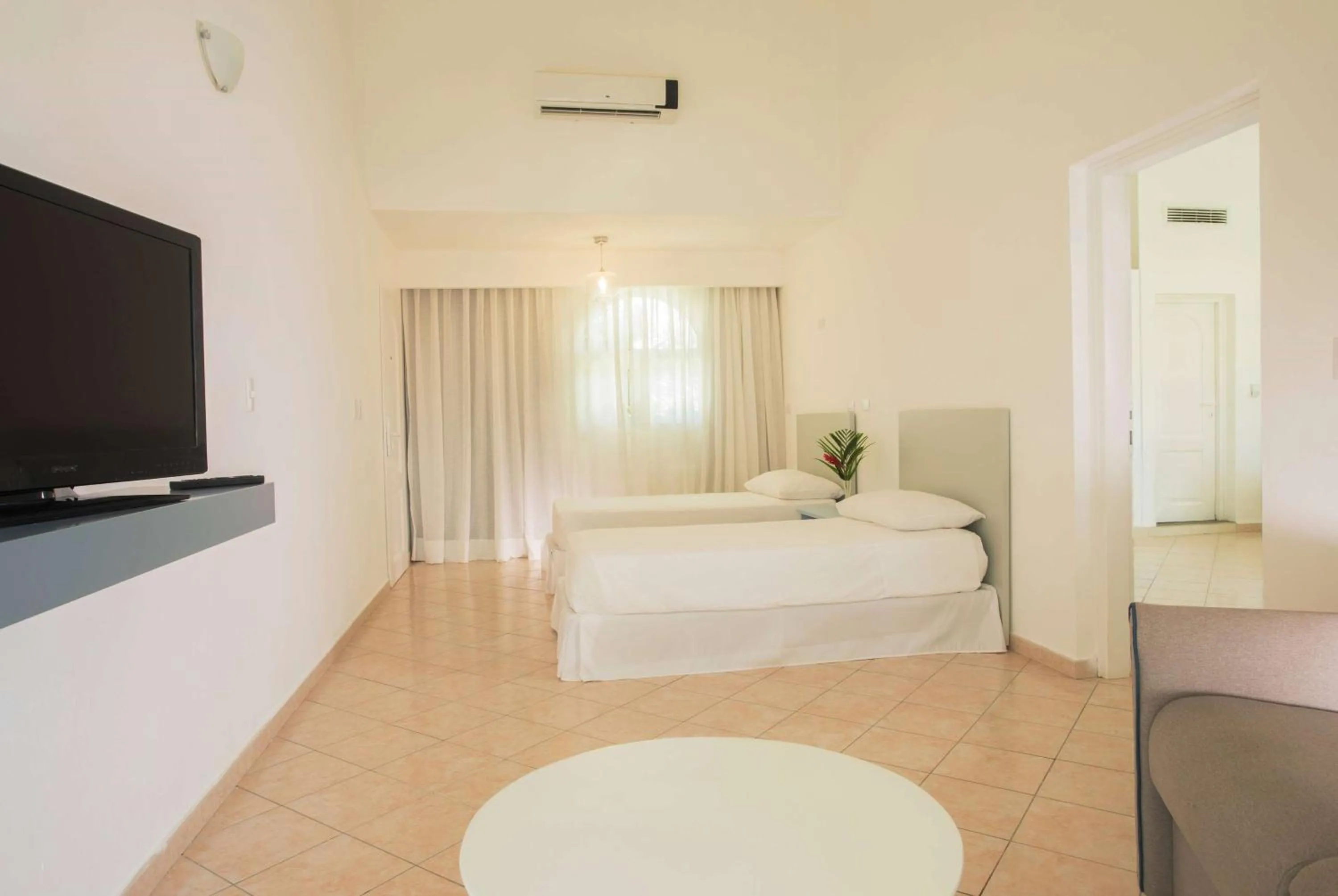 Photo of the whole room, Bed in Viva Tangerine by Wyndham, A Trademark All Inclusive