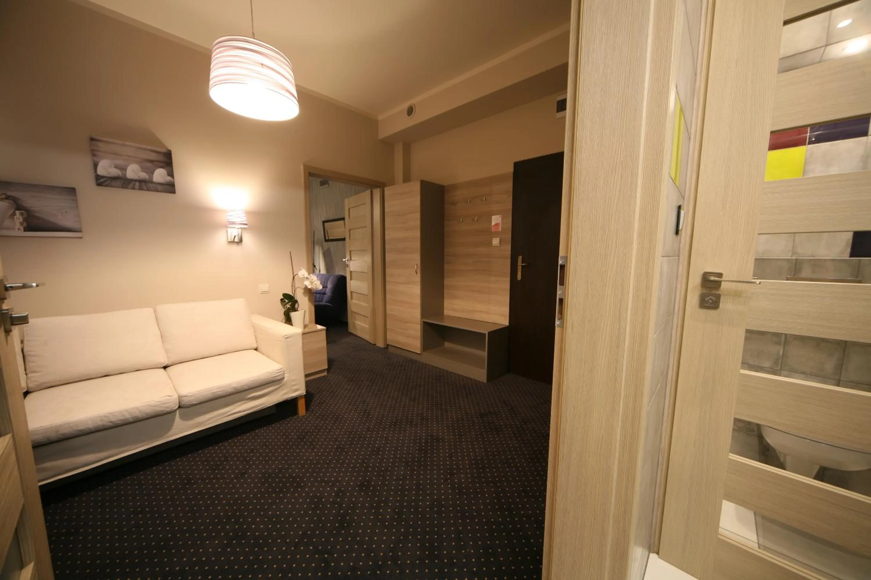 Living room, Bed in Hotel Seven 7