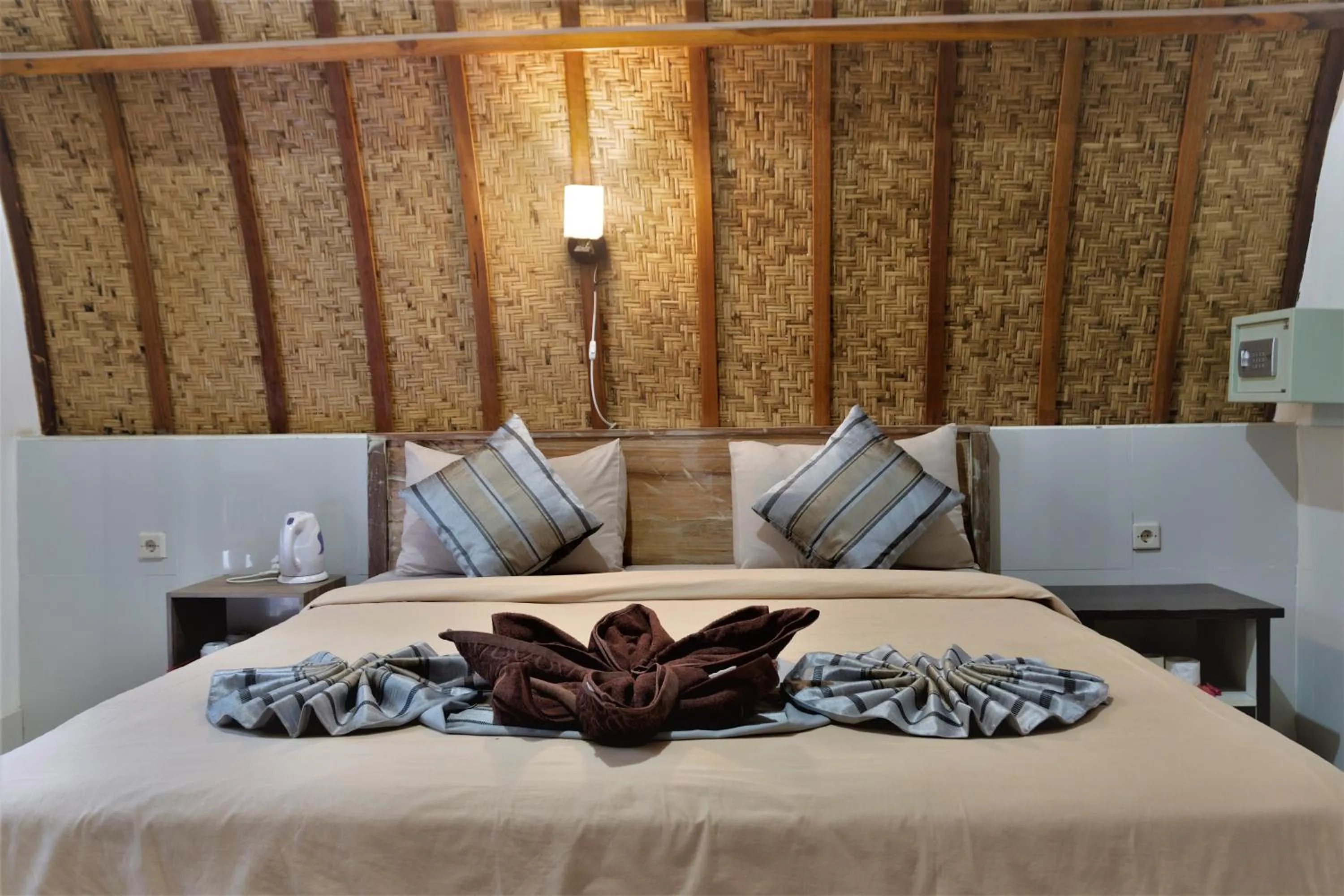 Bed in Warna Beach Hotel