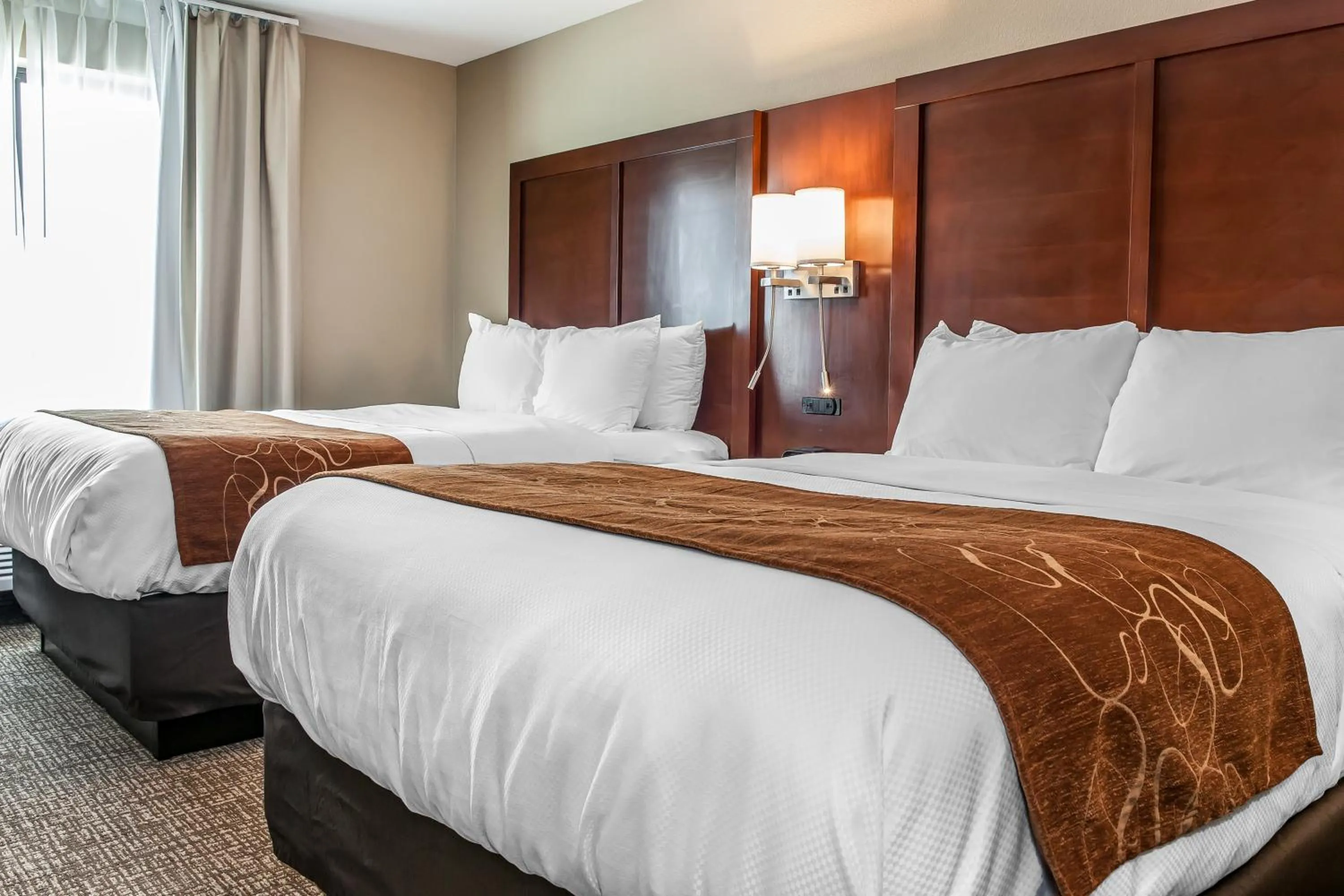 Bed in Comfort Suites Rensselaer near Fair Oaks