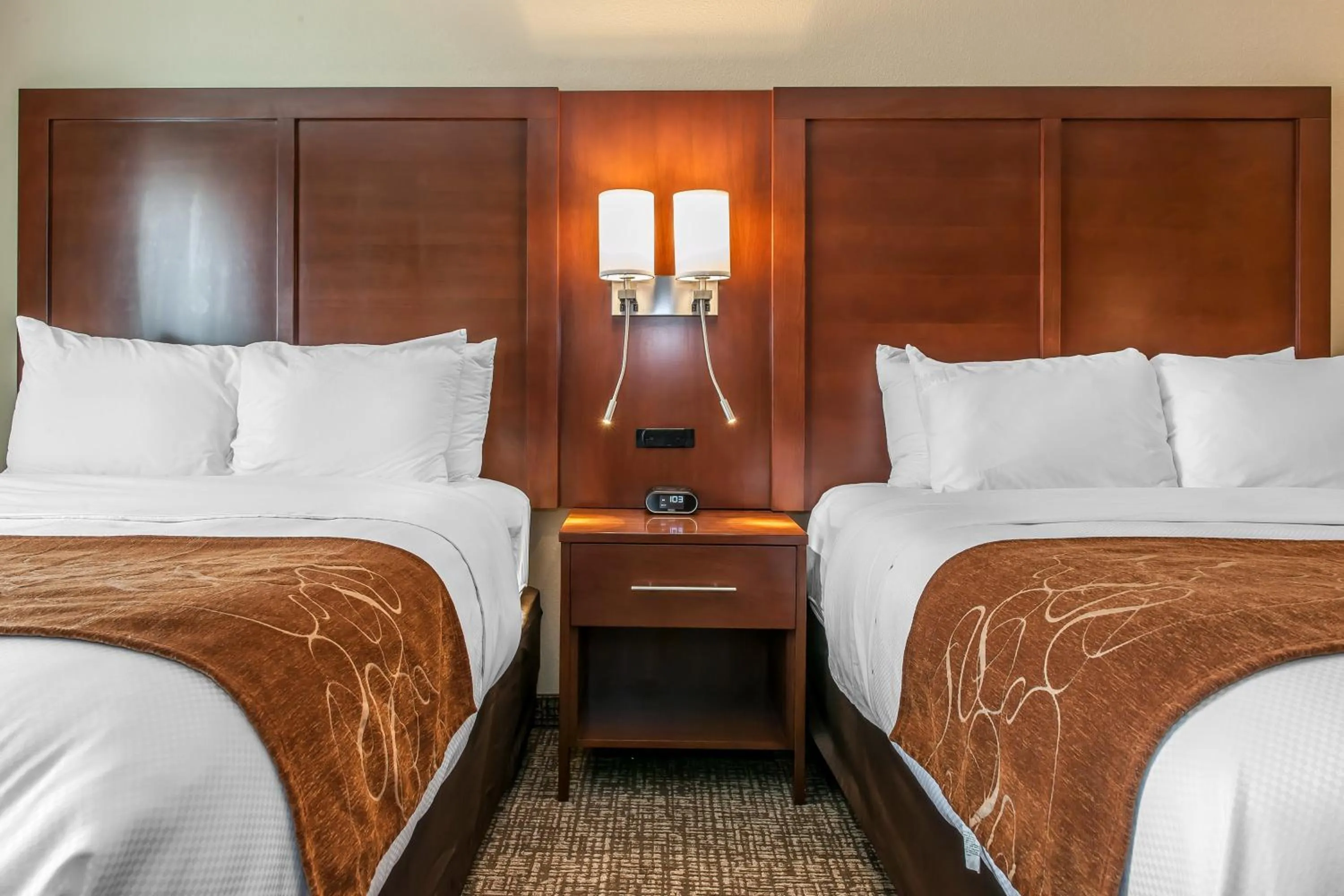 Bed in Comfort Suites Rensselaer near Fair Oaks