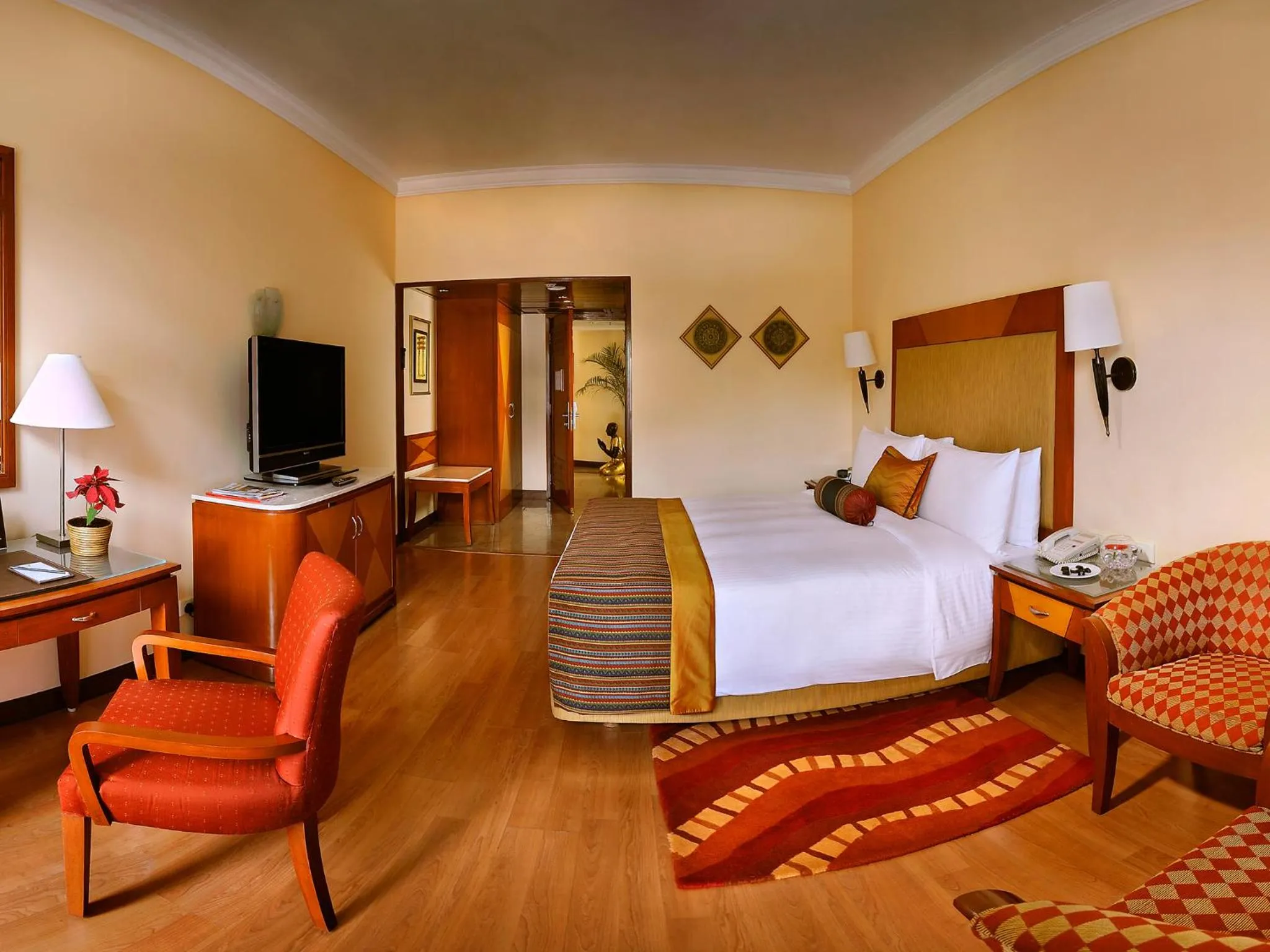 Photo of the whole room, Bed in The Lalit Ashok