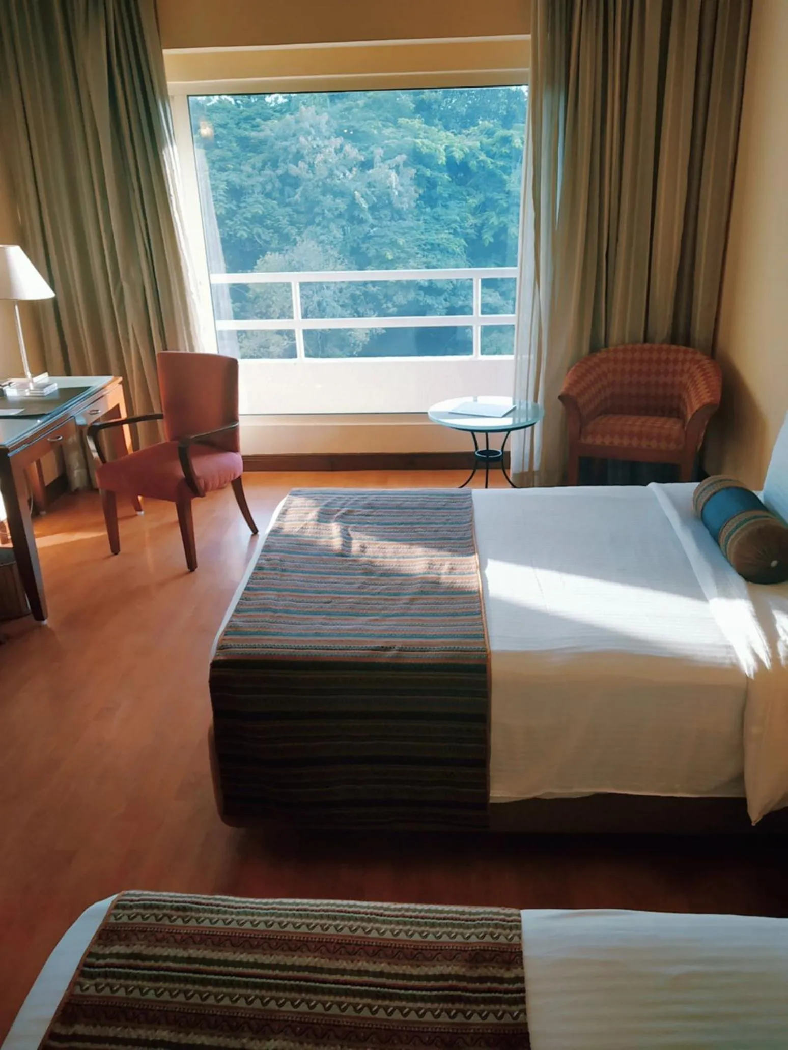 Photo of the whole room, Bed in The Lalit Ashok