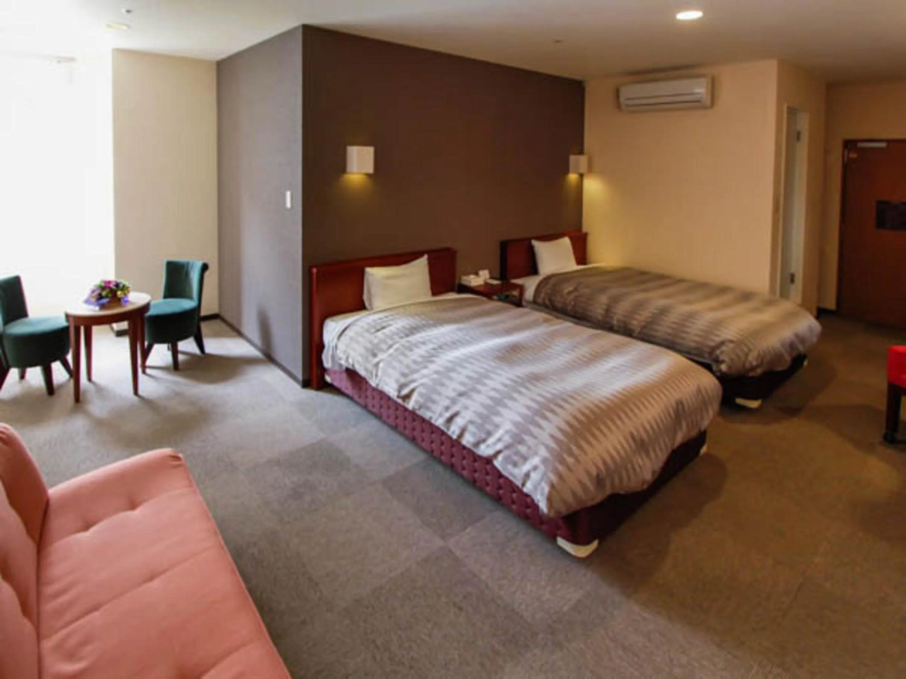 Living room, Bed in HOTEL LiVEMAX BUDGET Hamamatsu-Ekimae