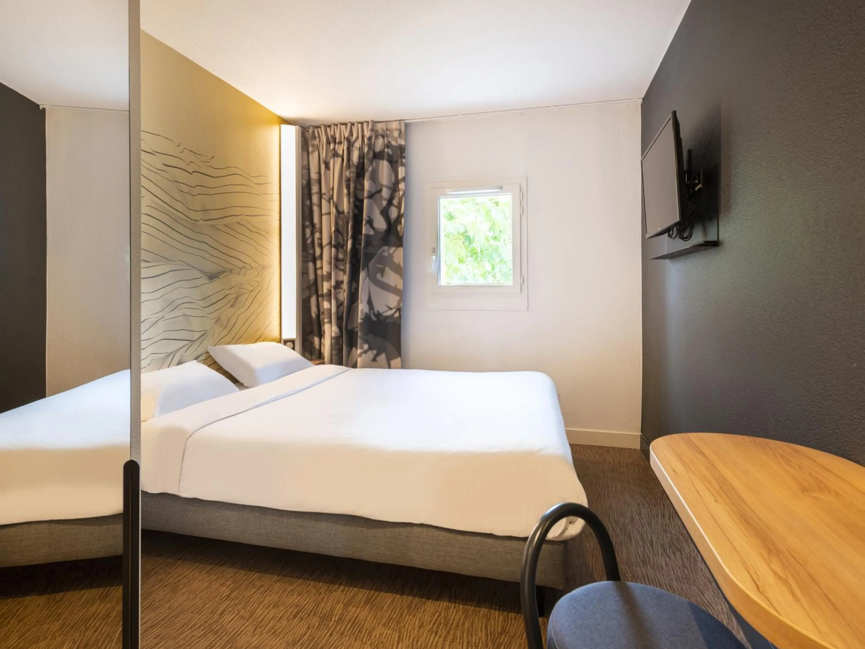 Bedroom, Bed in B&B HOTEL Cholet Nord