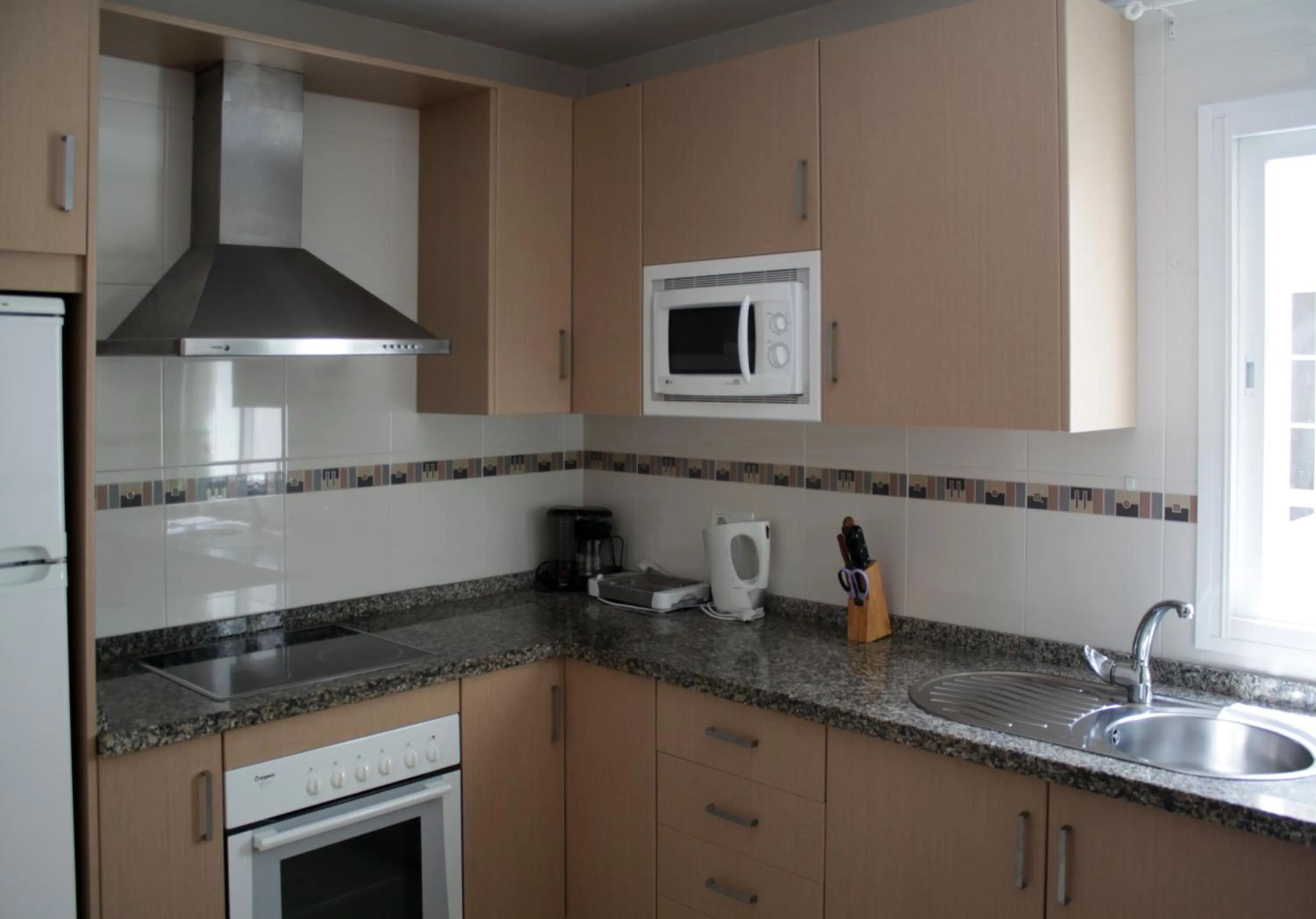 Kitchen or kitchenette in Apartamentos Turísticos Fercomar