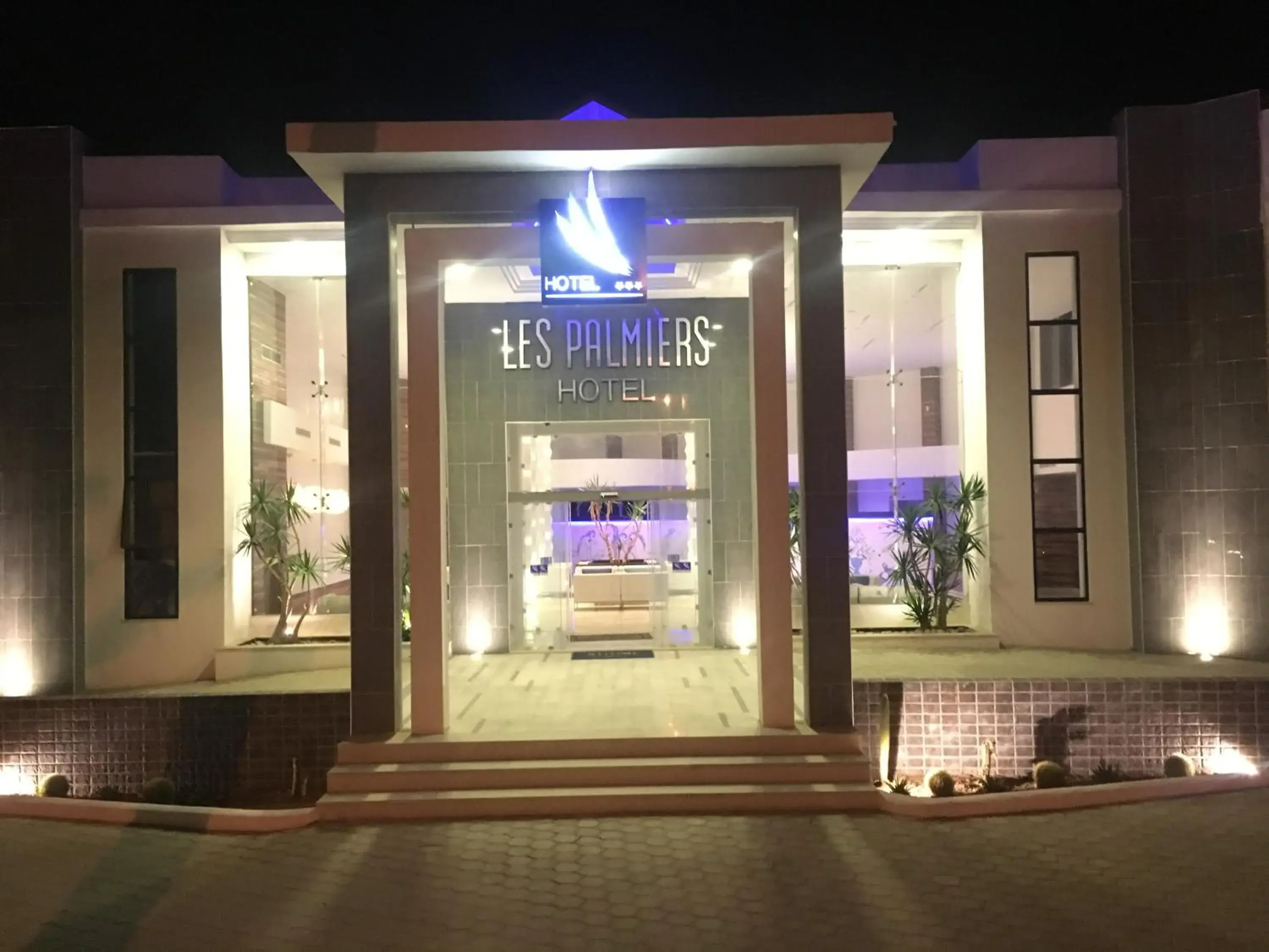 Property building in Hotel Les Palmiers Property building in Hotel Les Palmiers
