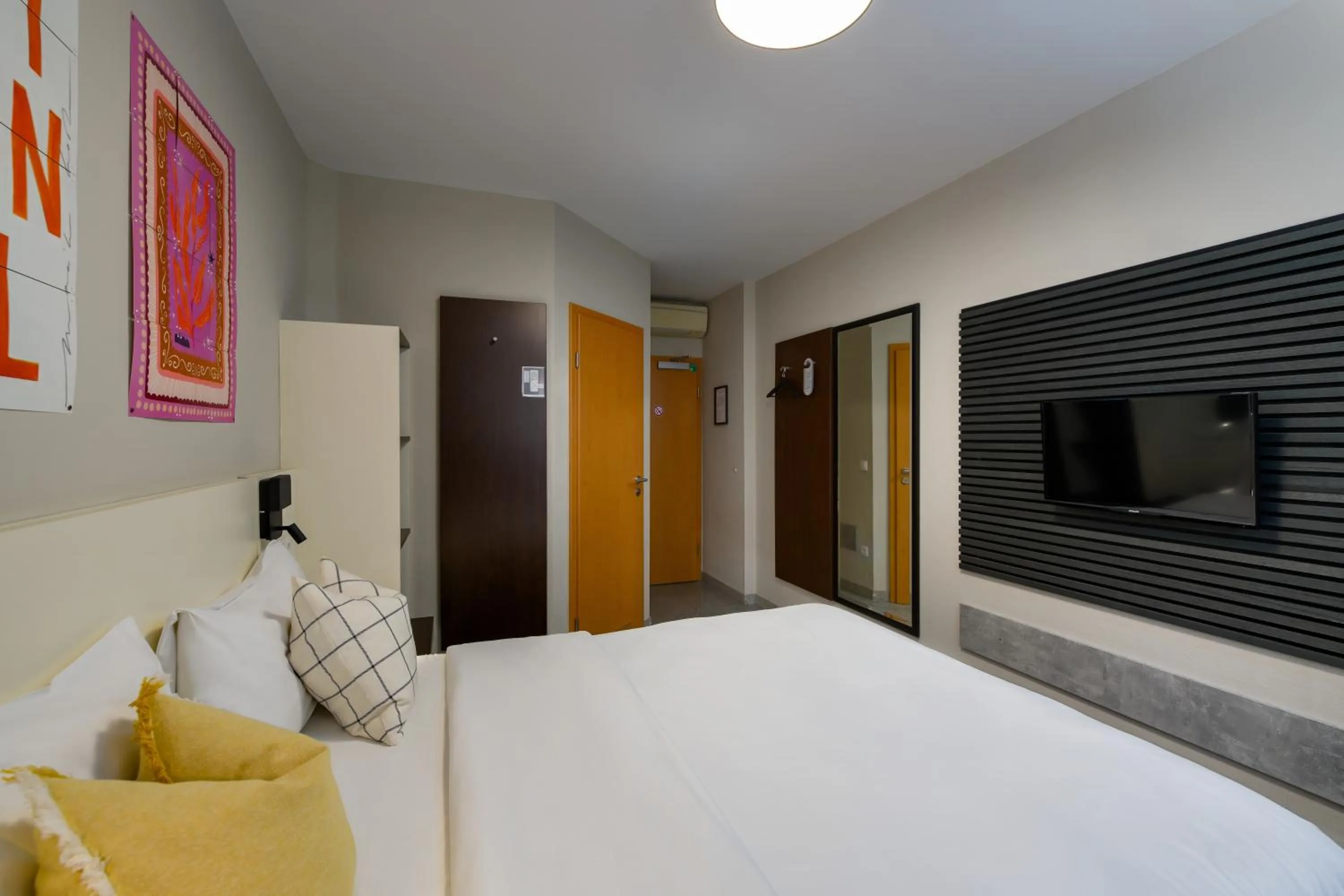 Bed in SleepinRoomz Boutique Hotel